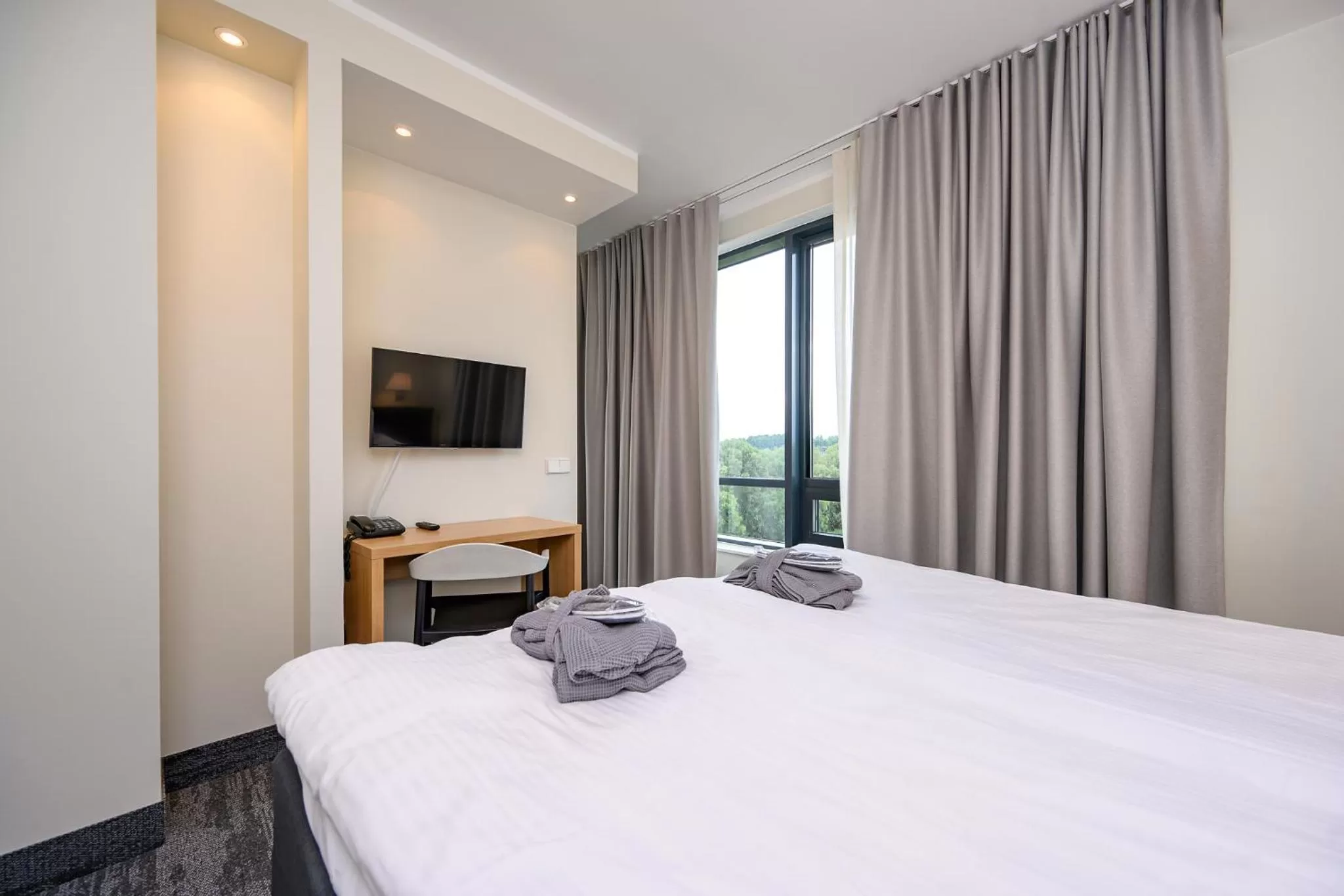 River view, Bed in Dorpat Hotel