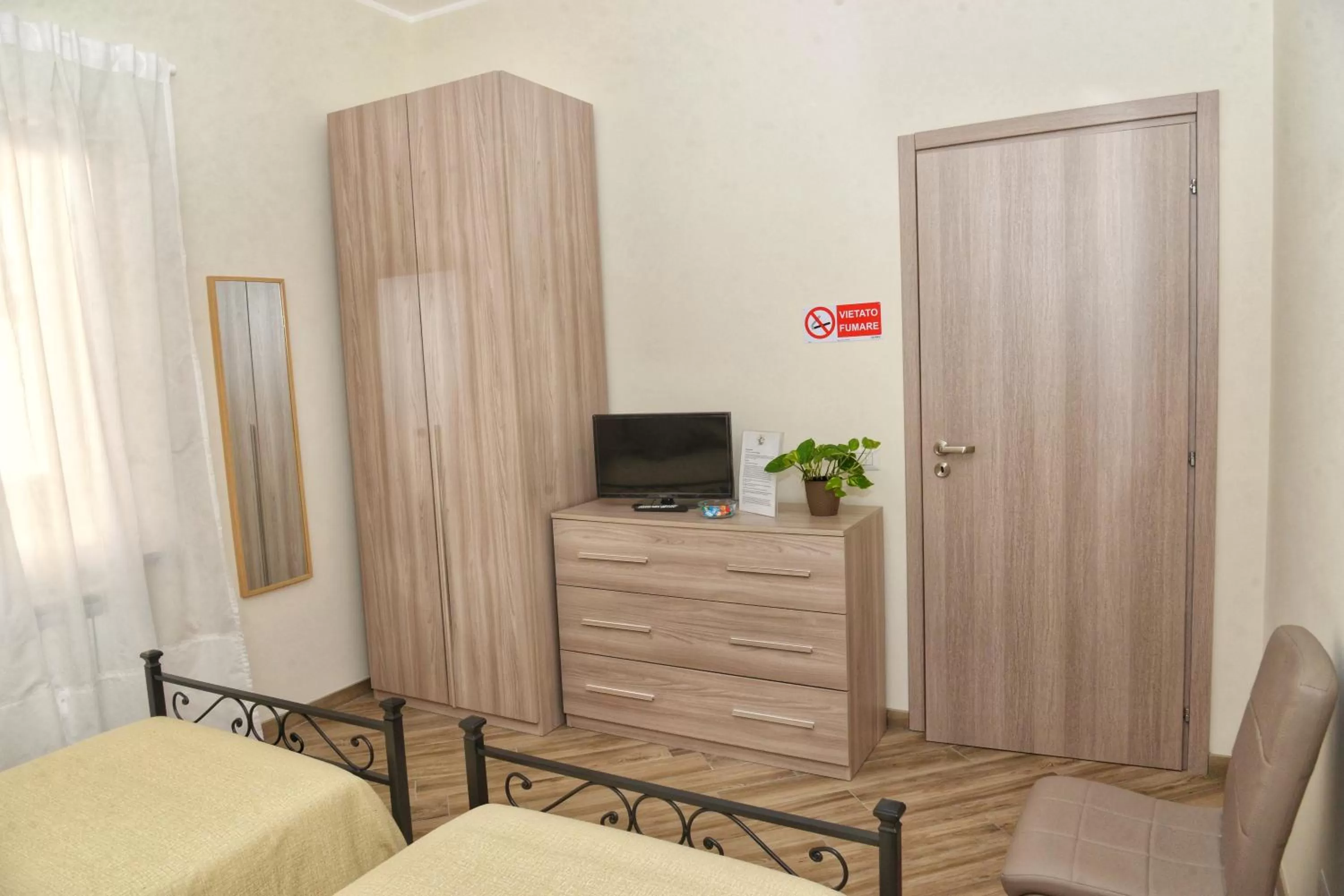 Bedroom, TV/Entertainment Center in B&B MONDAY