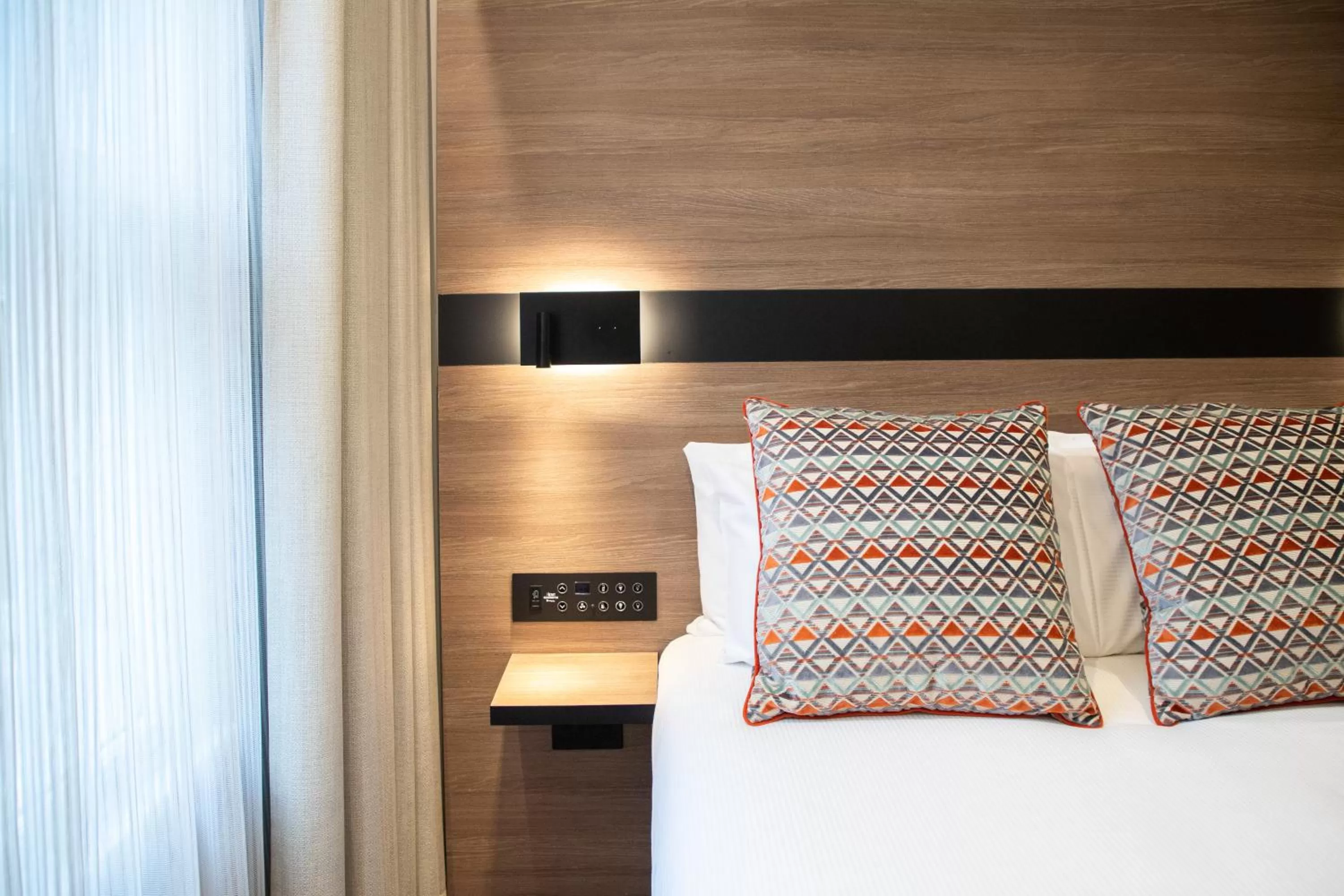 Bed in Merit Kensington Hotel