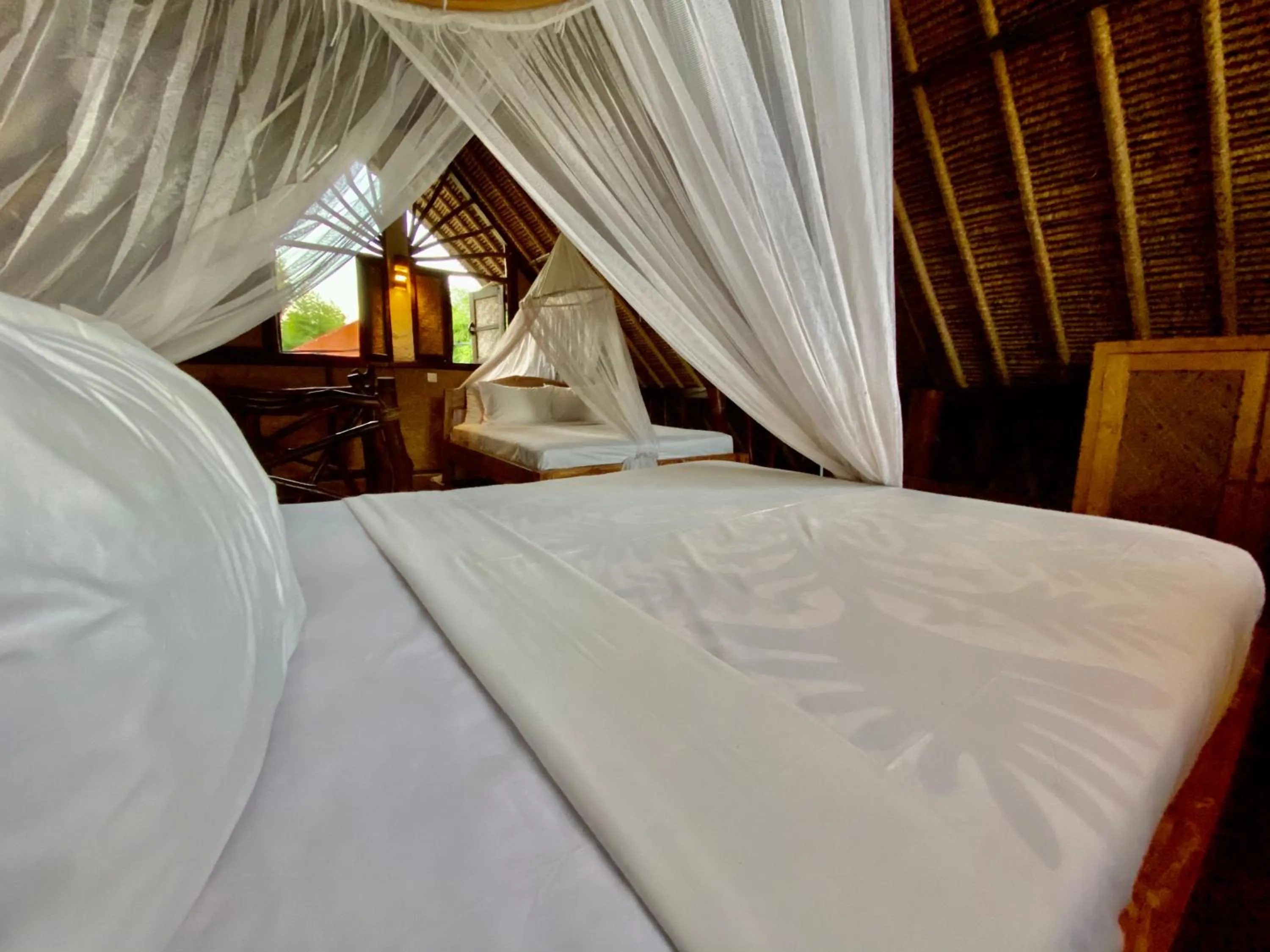 Bed in Flower Bud Bungalow Balangan