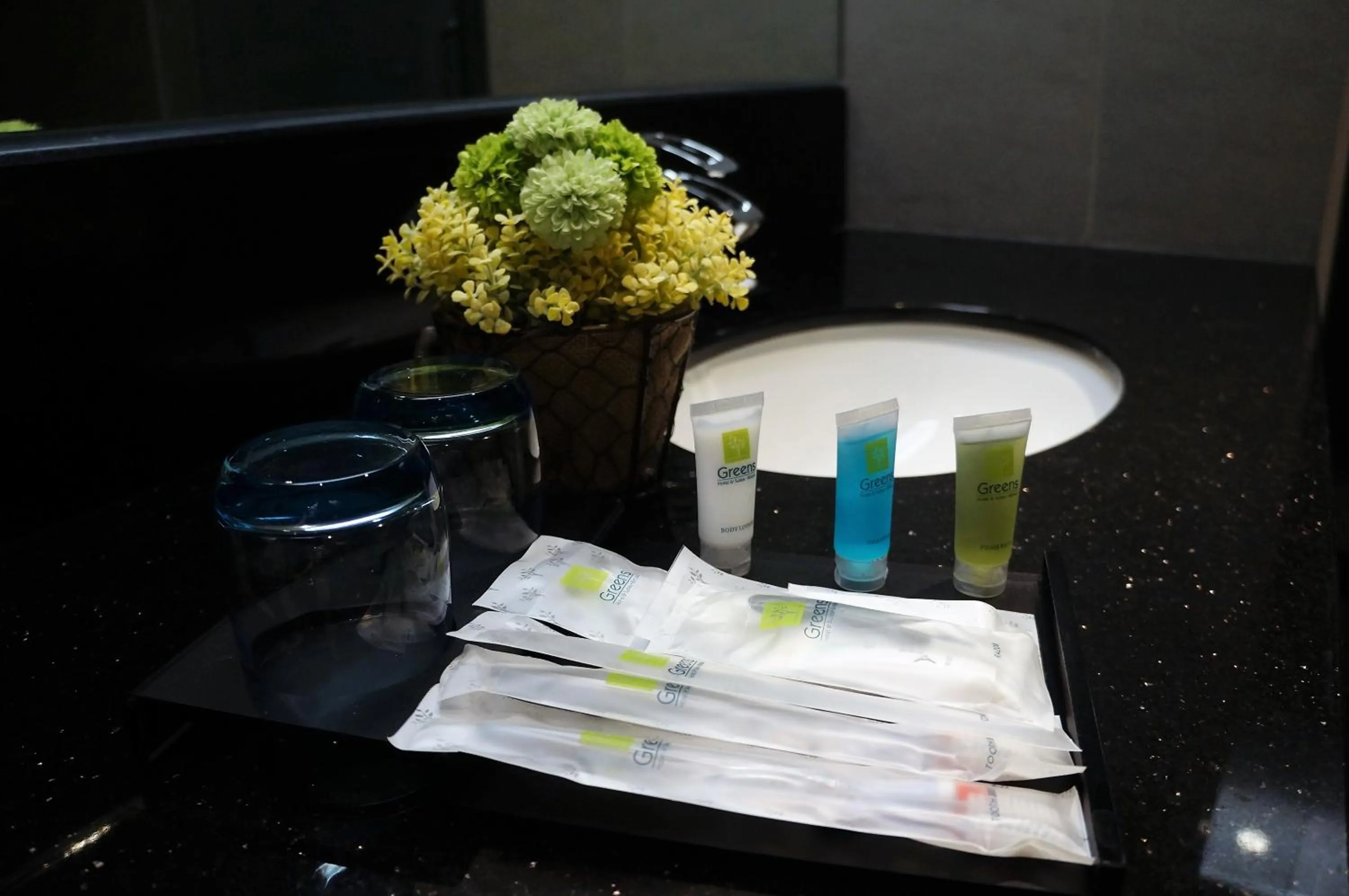 Bed in Greens Hotel & Suites