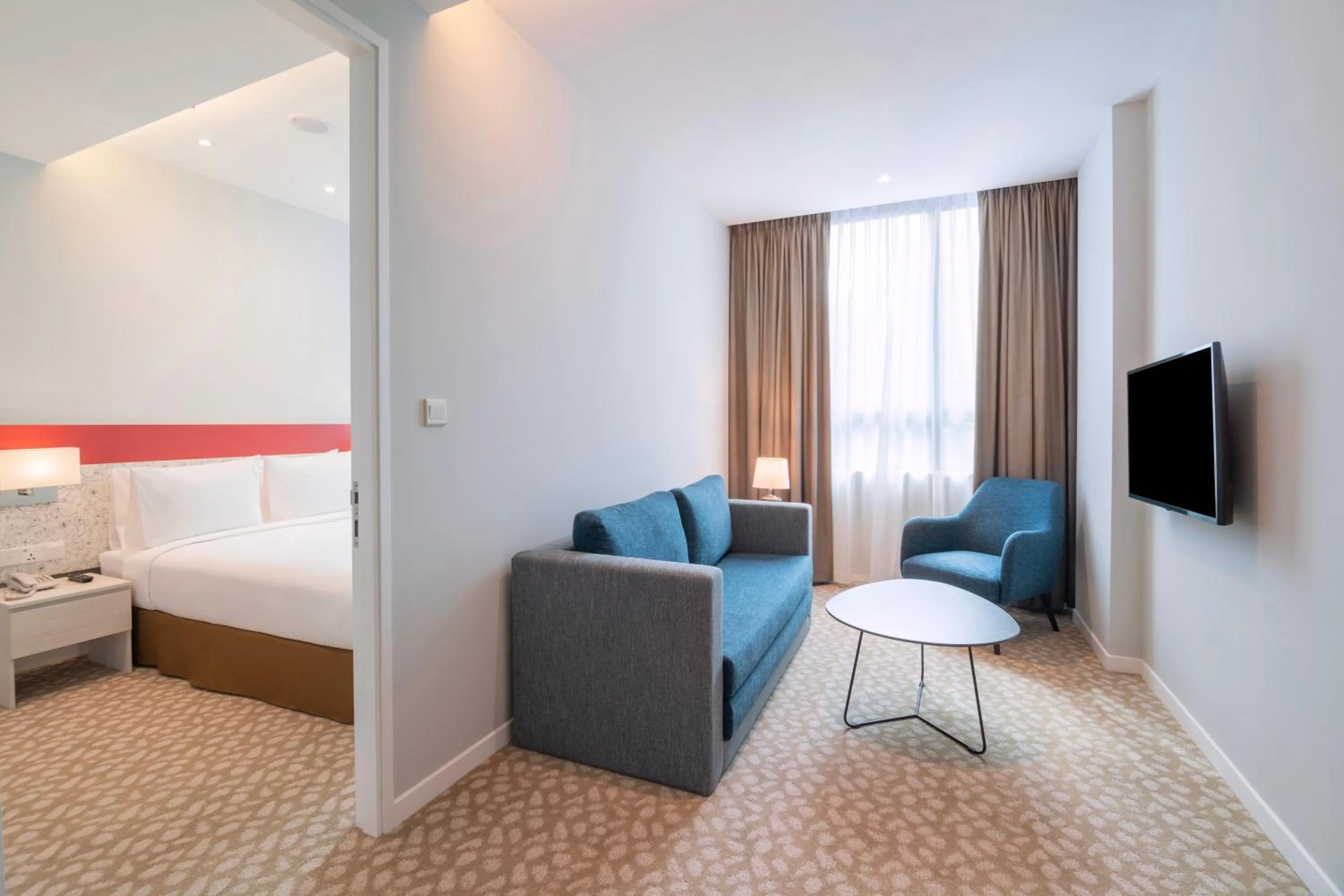 Living room, Bed in Holiday Inn Express & Suites Johor Bahru by IHG
