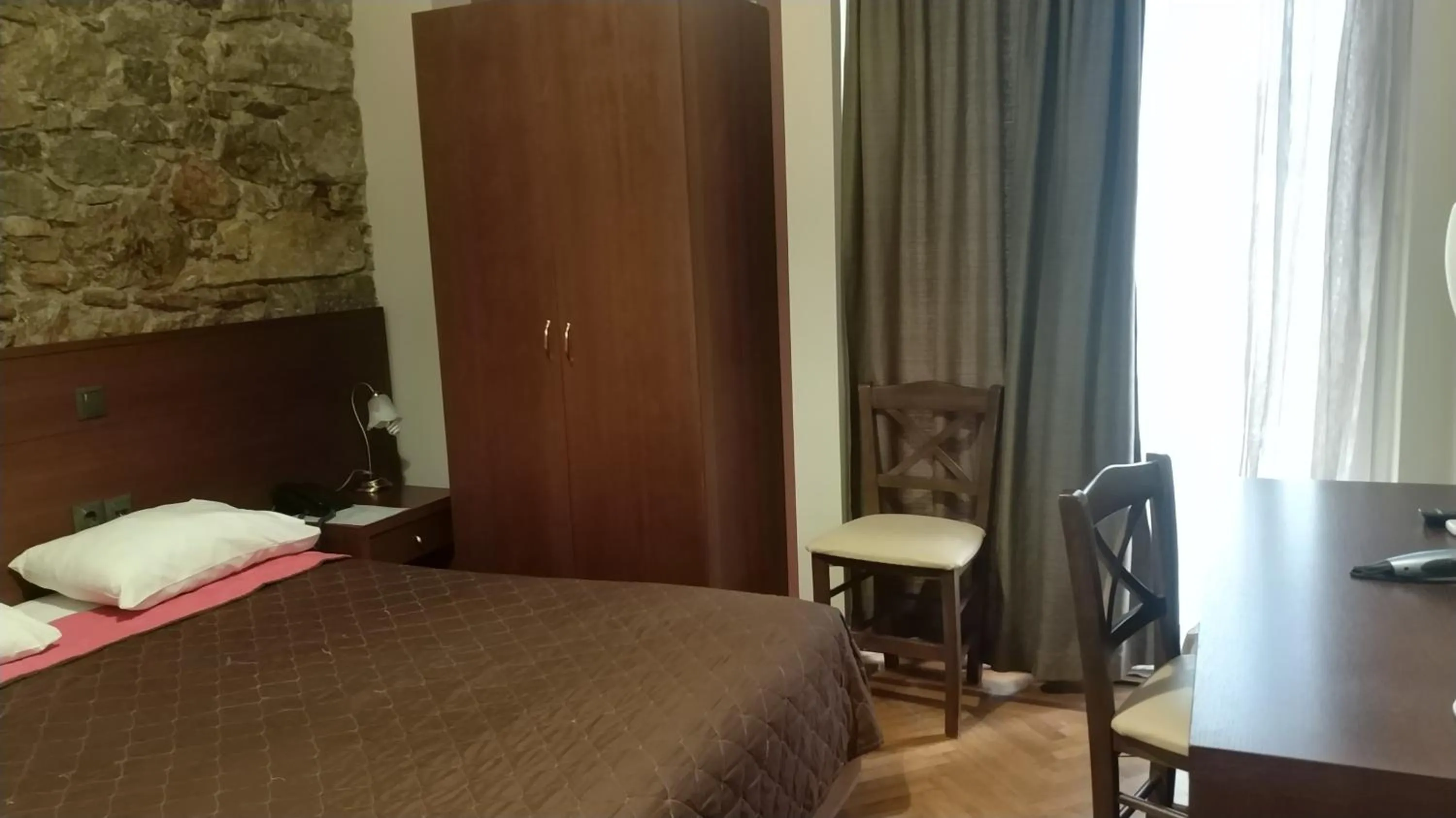 Bed in Ambrosia Suites