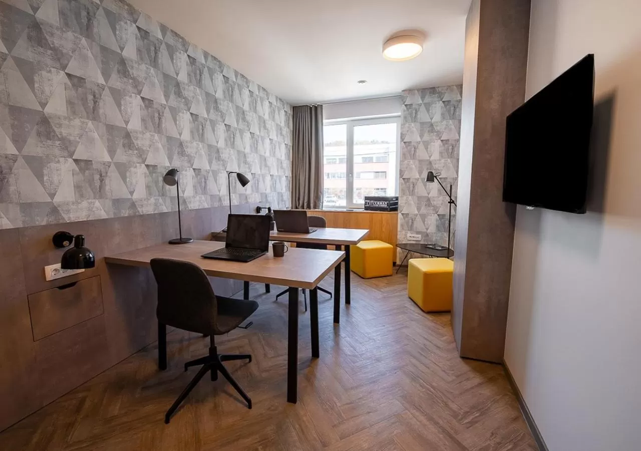 Communal lounge/ TV room in Urban Ring Hotel