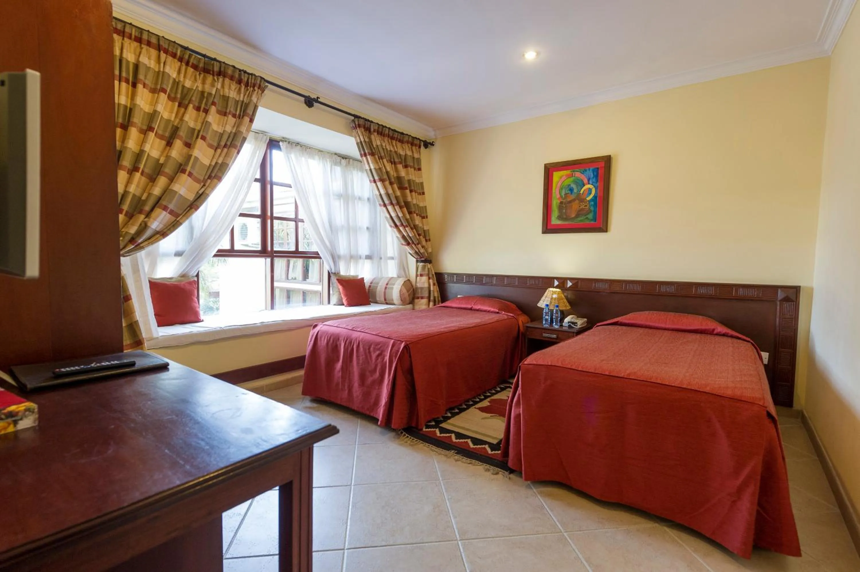 Photo of the whole room, Bed in African Tulip Hotel