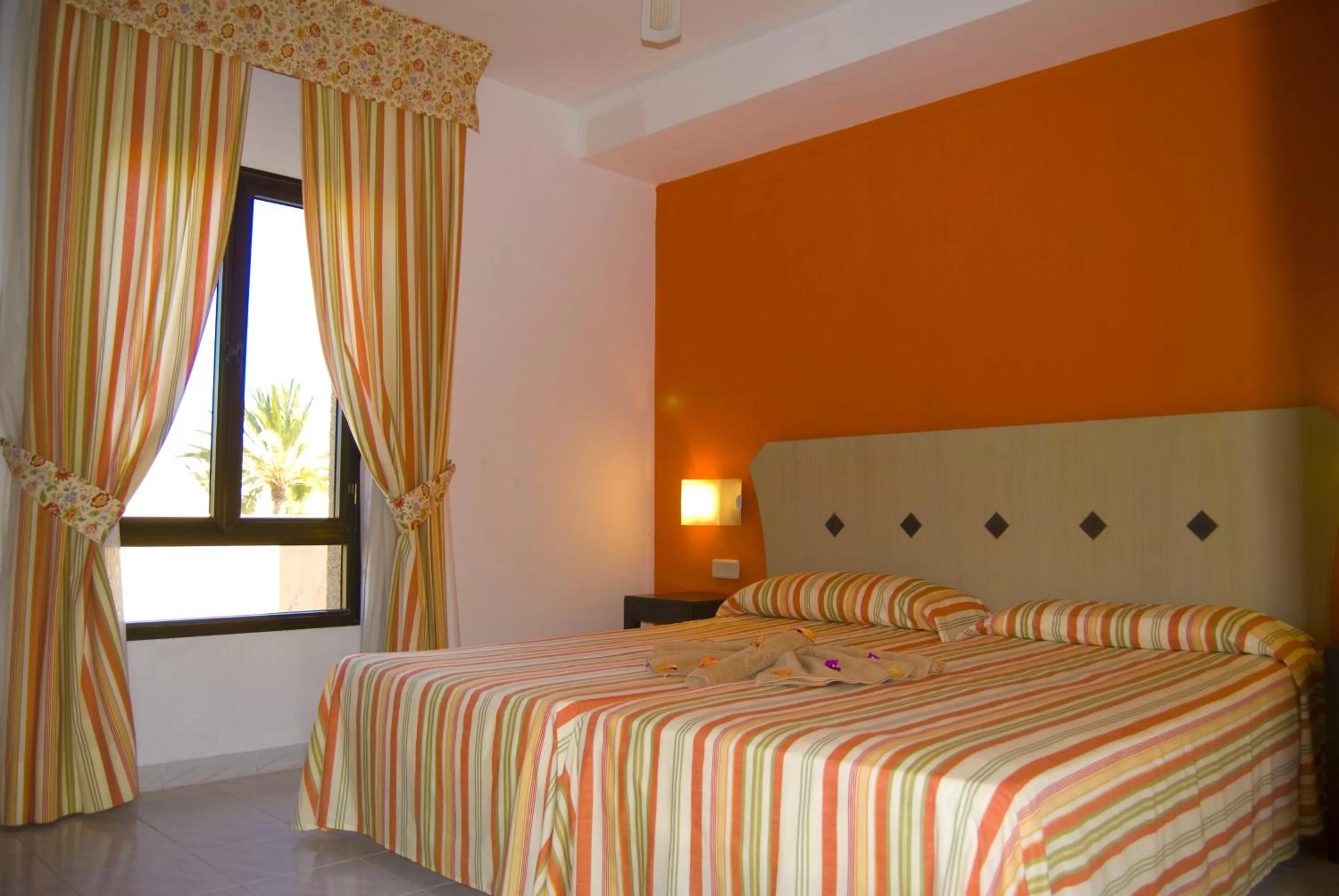 Bed in SBH Taro Beach Hotel