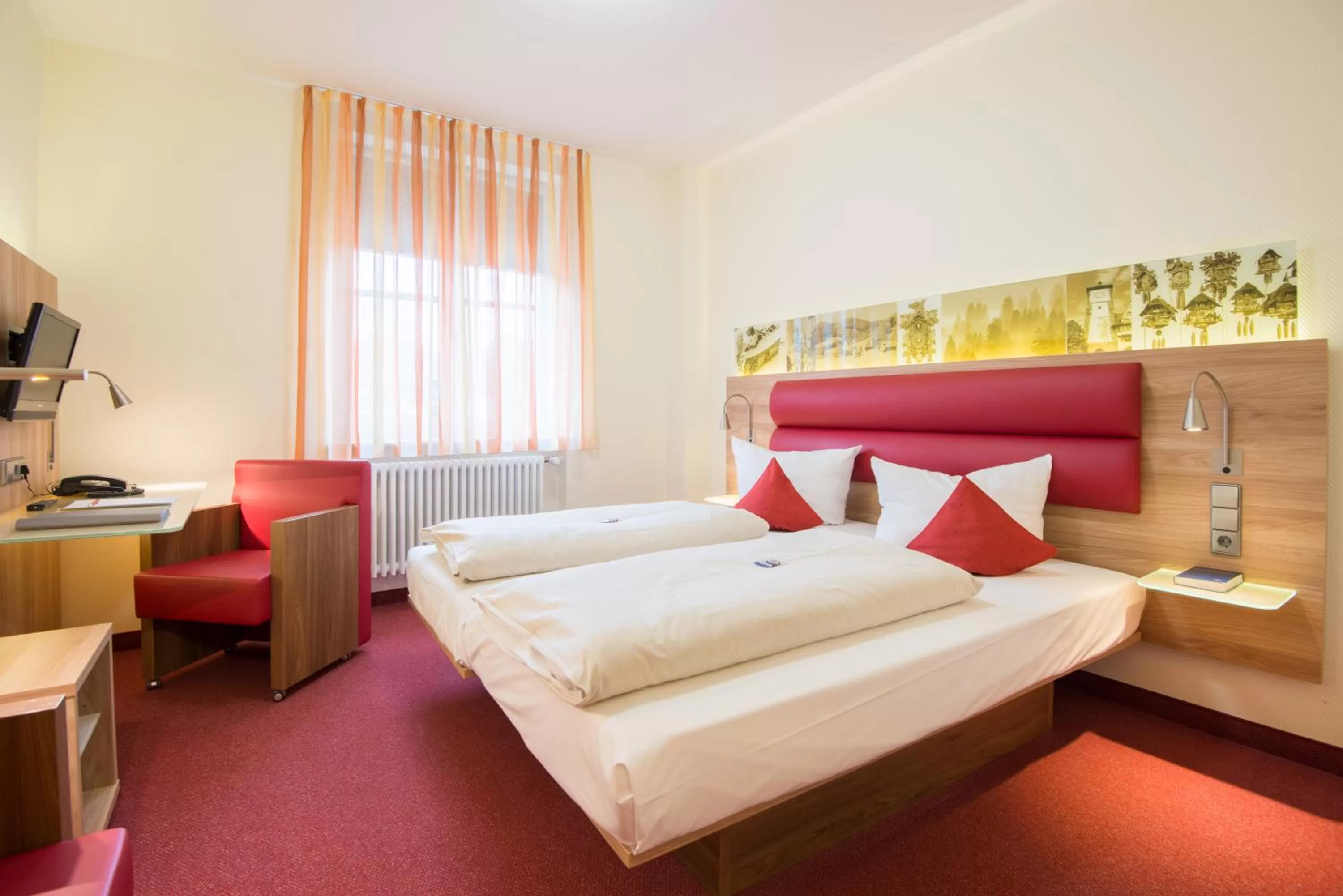Photo of the whole room, Bed in Stadthotel Freiburg Kolping Hotels & Resorts