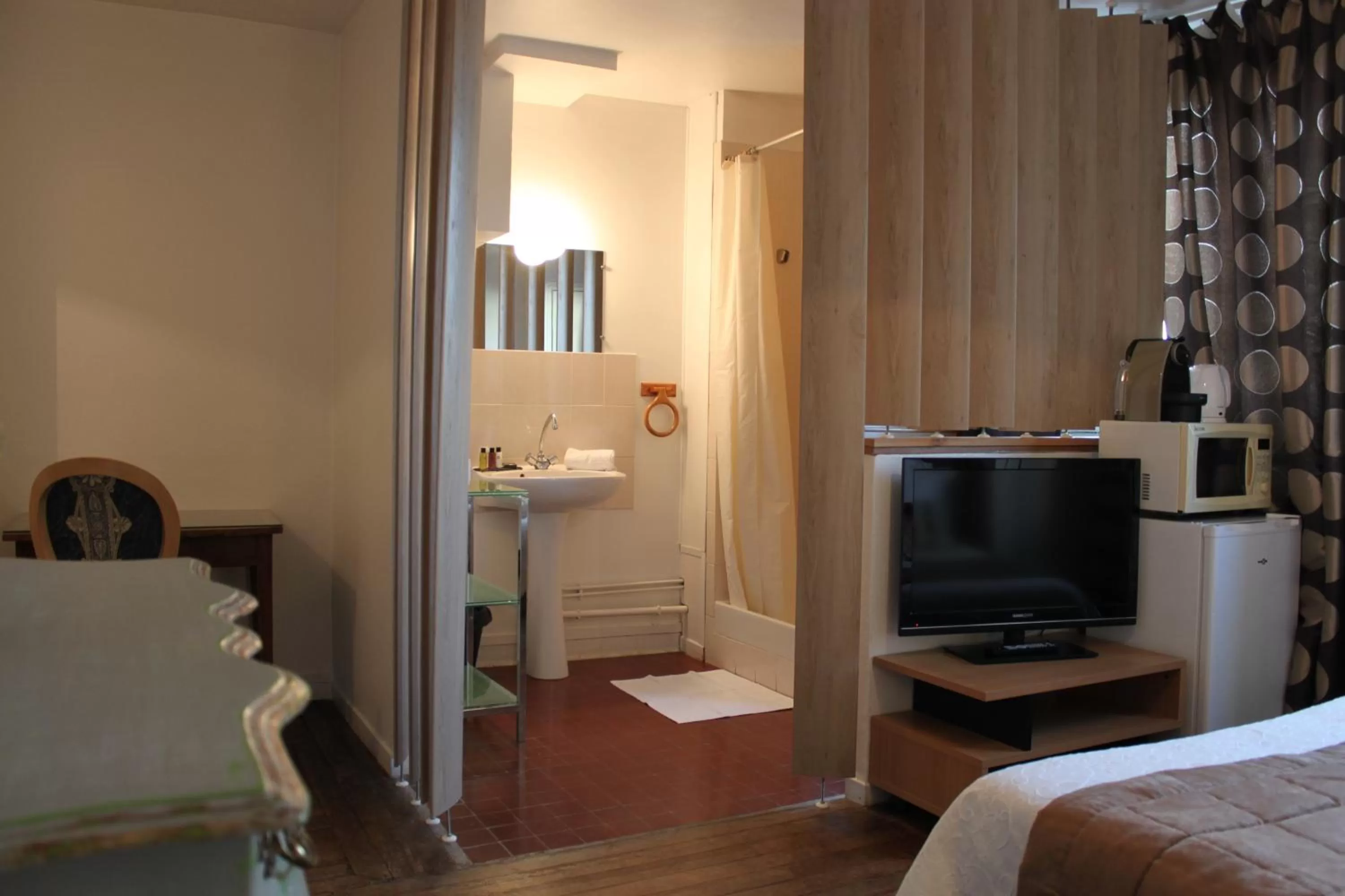 TV/Entertainment Center in Résidence et Chambres d'Hôtes de La Porte d'Arras