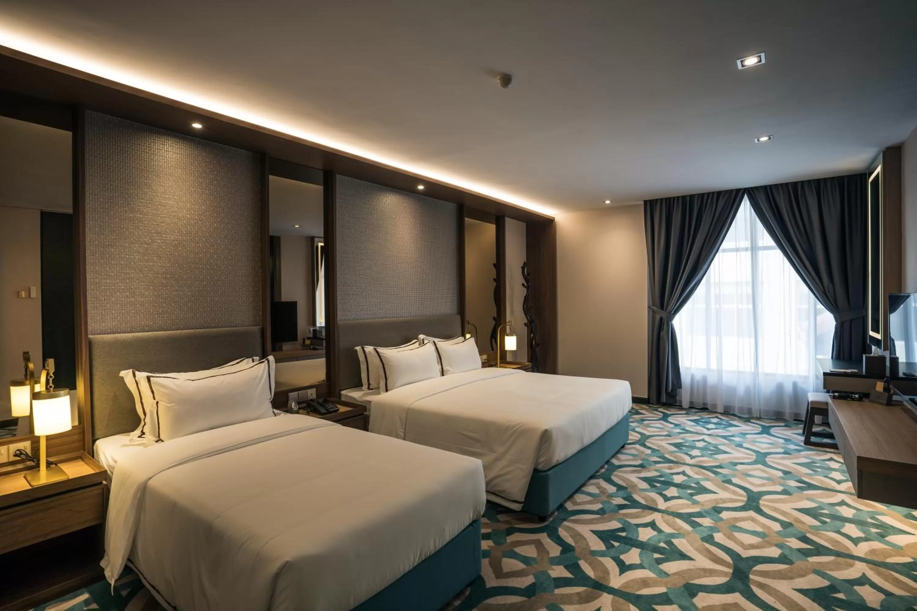 Bed in CHRISTEE SUITES HOTEL