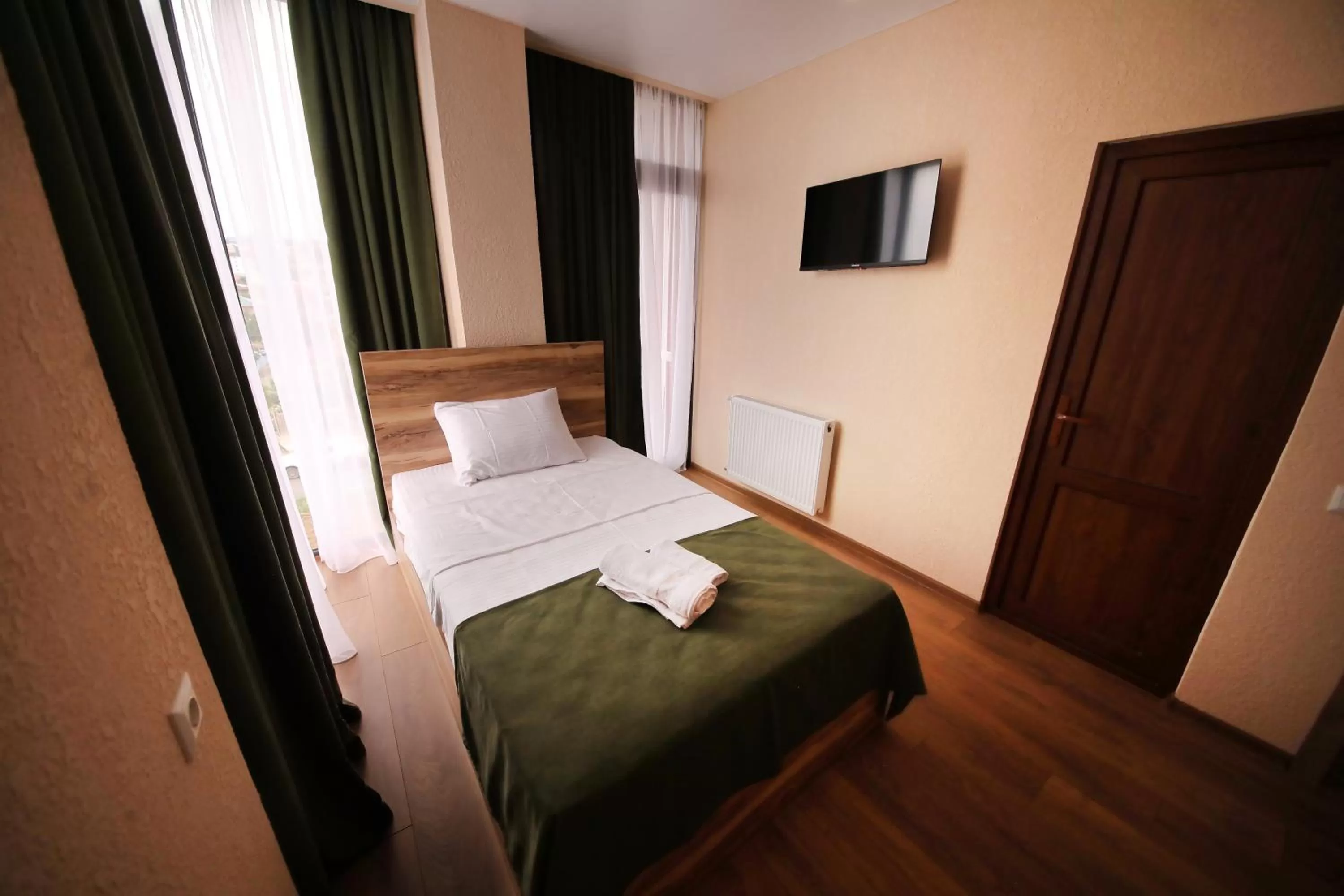 Bed in Bessarion Boutique Hotel