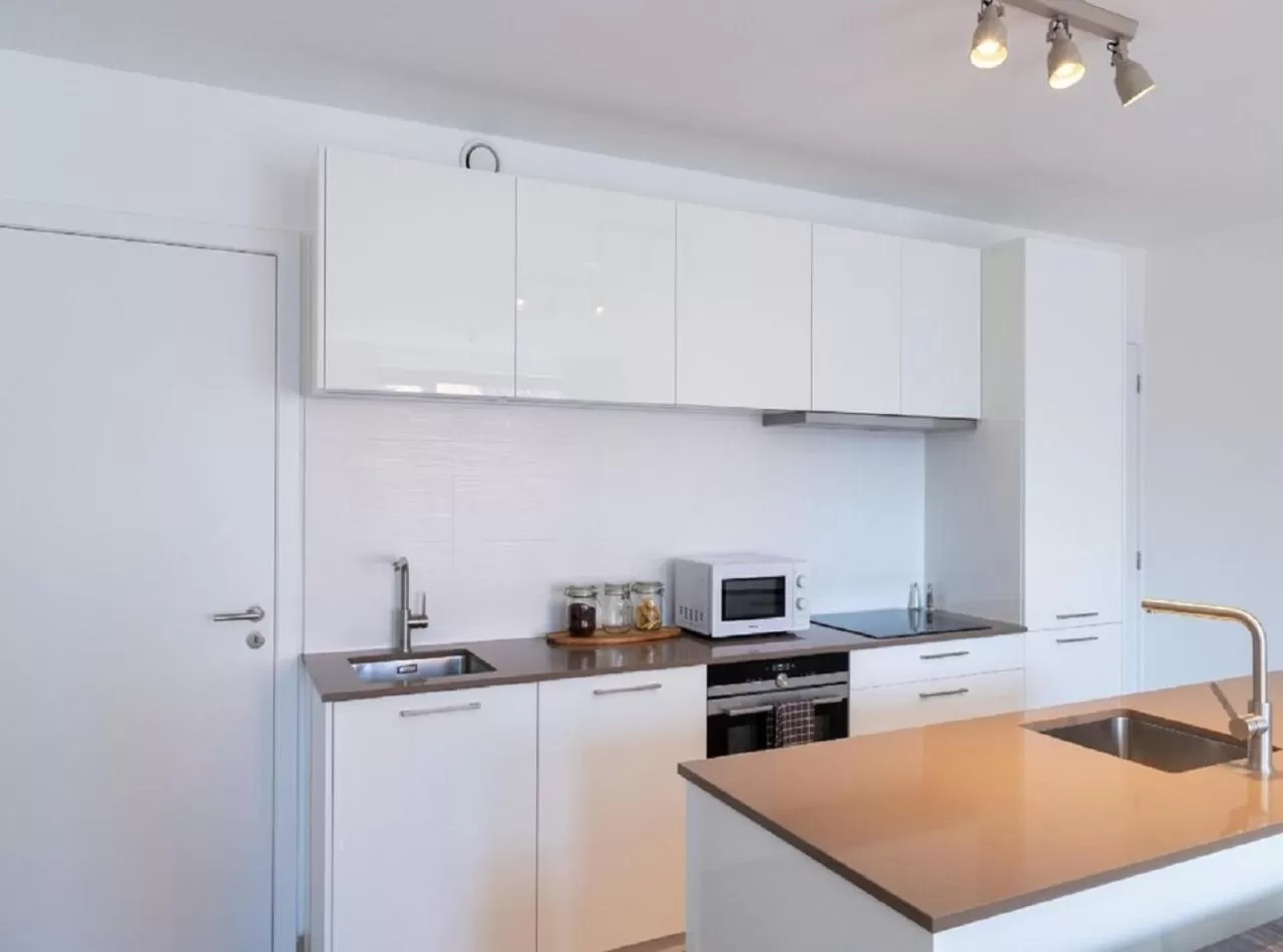 Kitchen or kitchenette in OneLuxStay near Diamond District