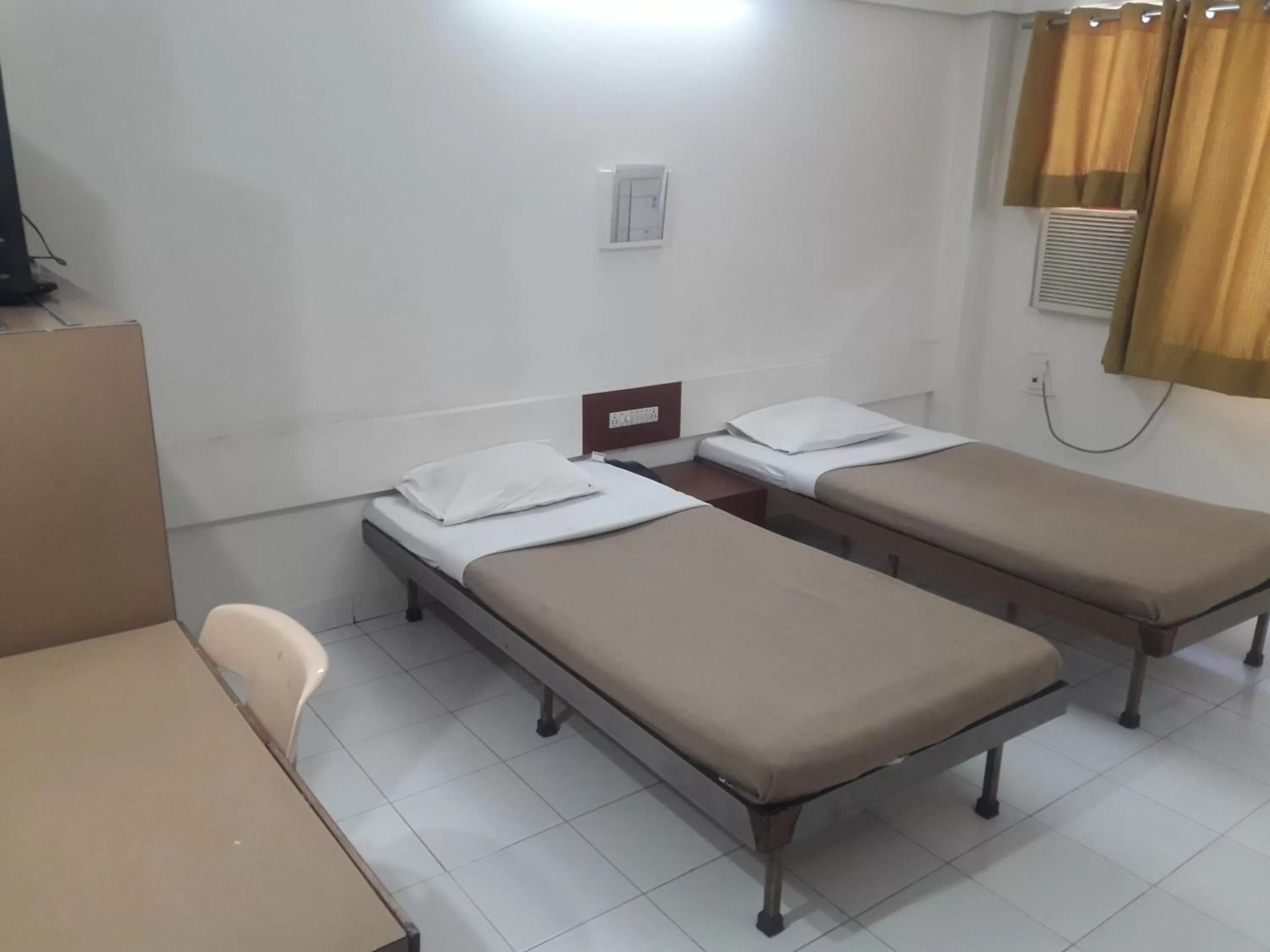 Photo of the whole room, Bed in Maurya Residency