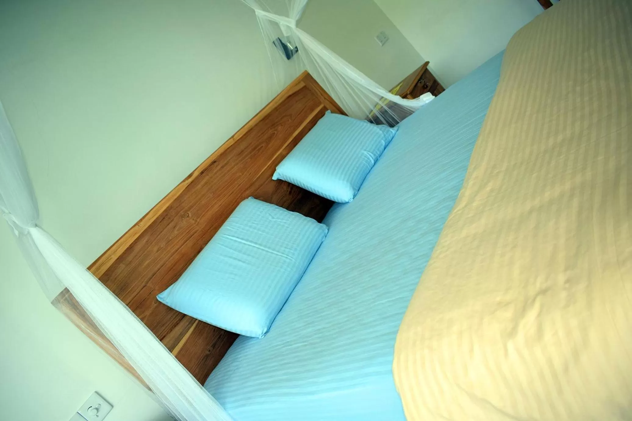 Bed in Raveena Guest House