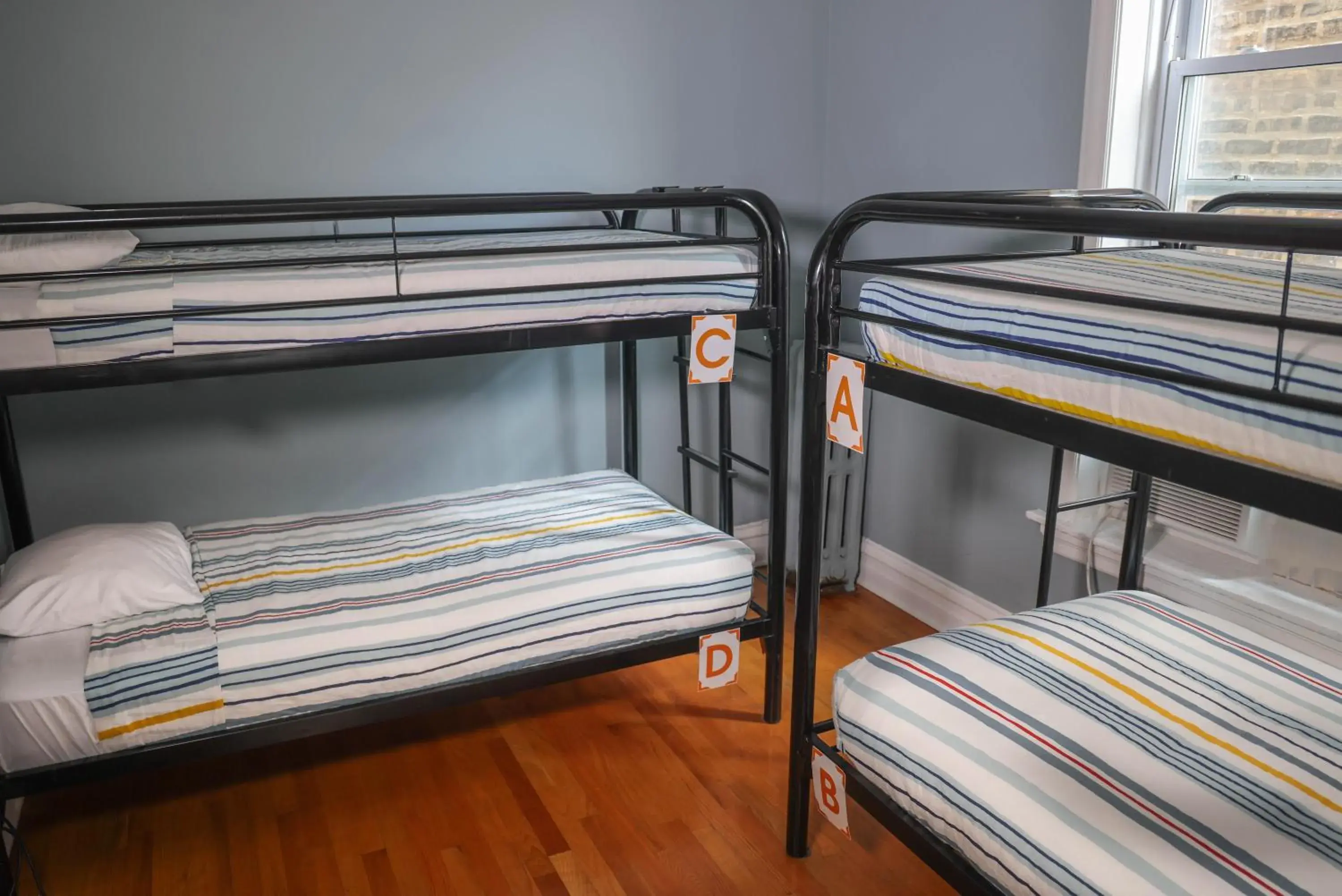 Single bed in 4-Bed Dormitory Room - Female Only in Wrigley Hostel - Chicago Single bed in 4-Bed Dormitory Room - Female Only in Wrigley Hostel - Chicago