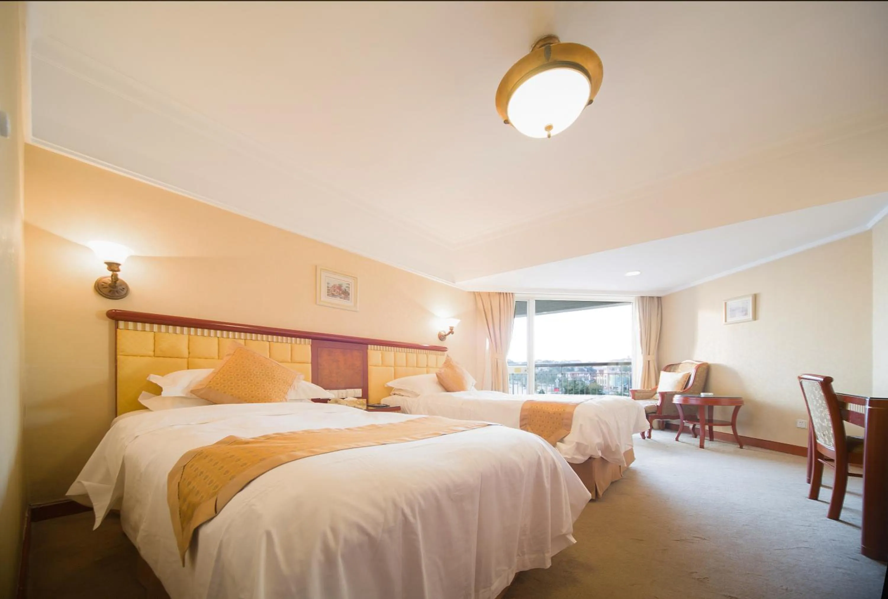 Bed in Huiquan Dynasty Hotel Qingdao