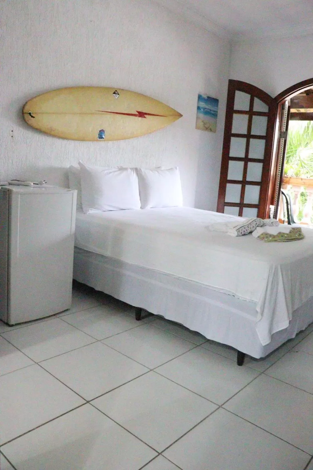 Bed in Pousada Praia do Tombo