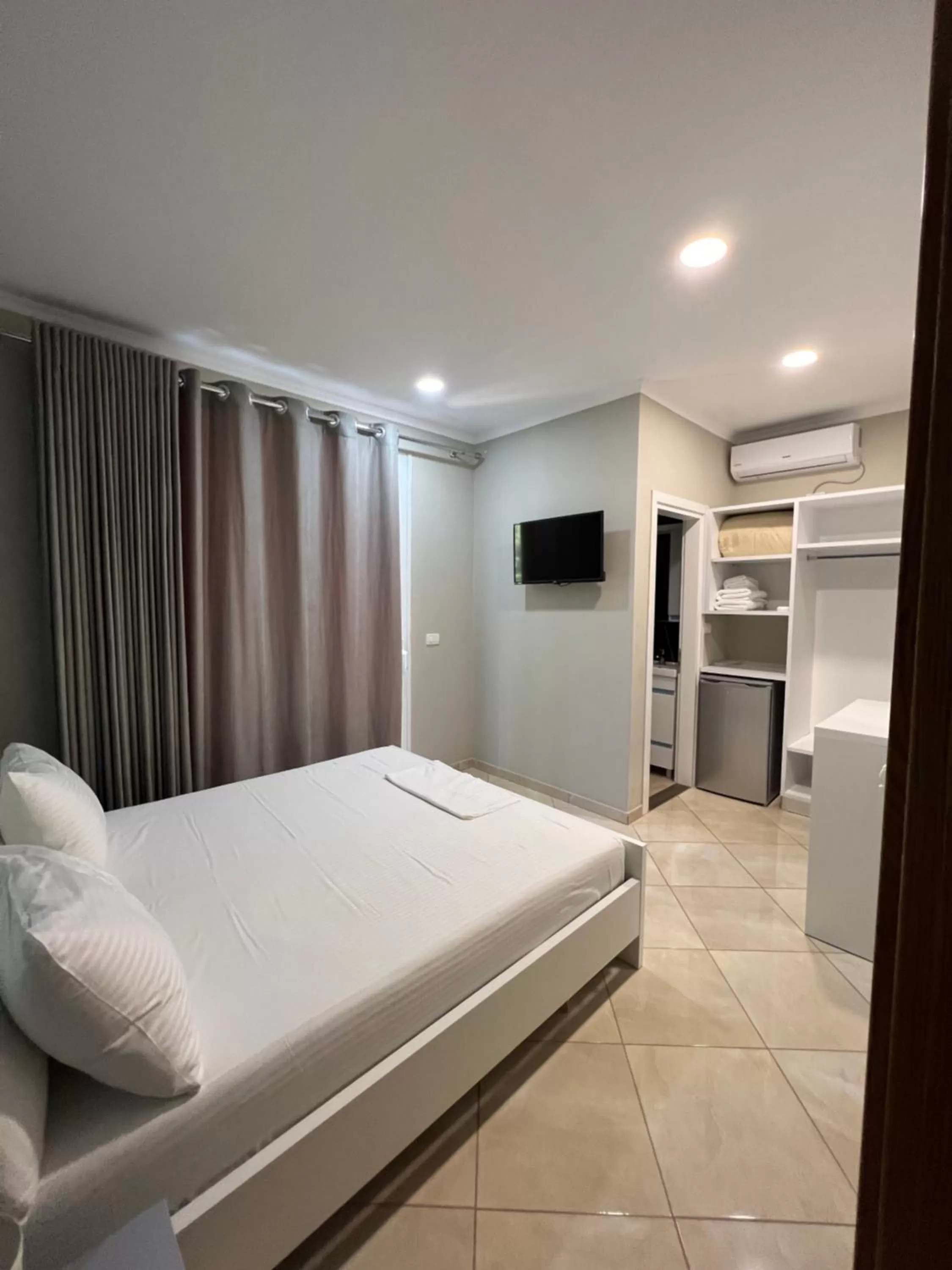 Bed in Aphrodite Garden Rooms & Apartment