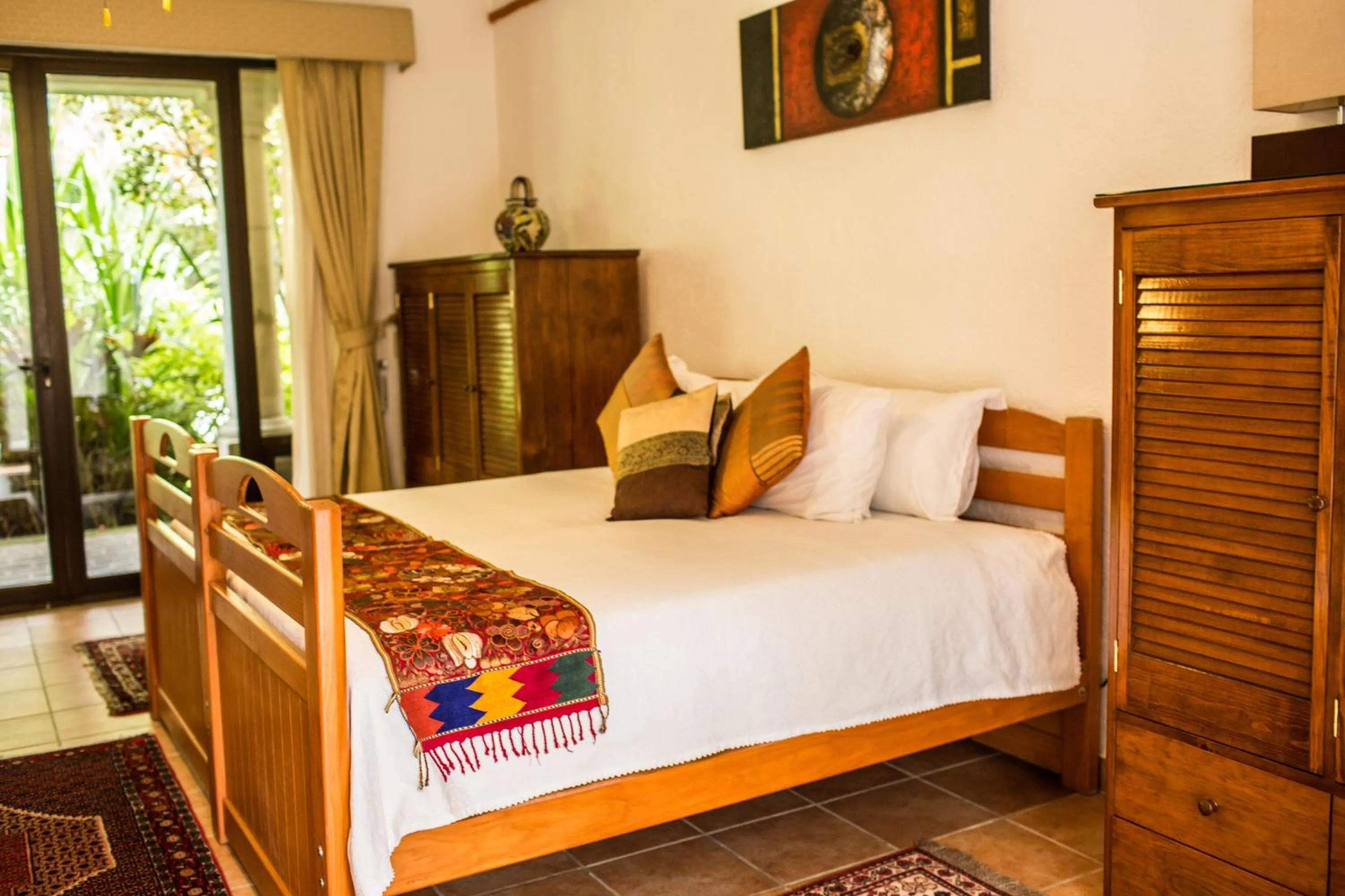 Bed in La Buena Vibra Wellness Resort & Spa