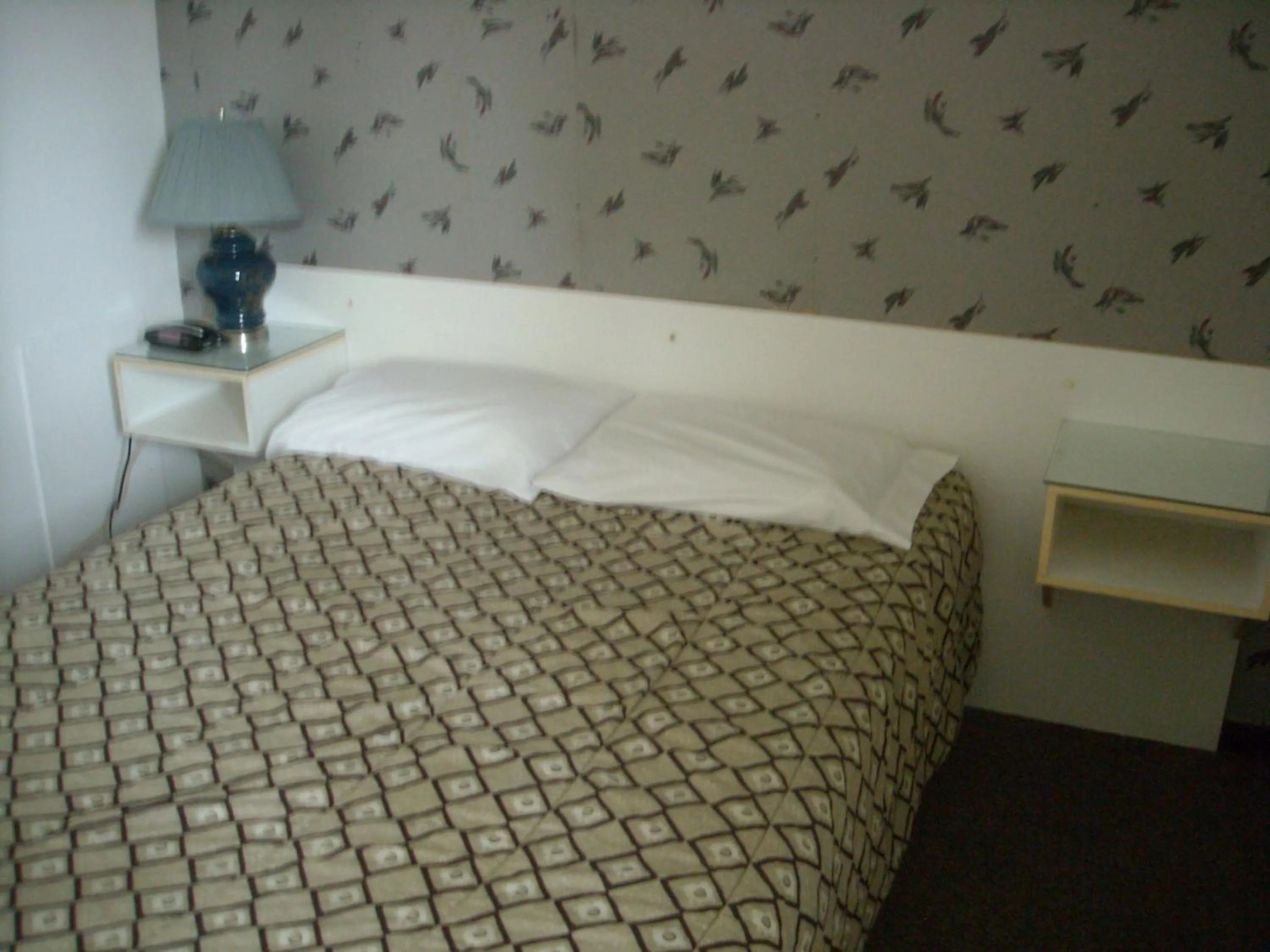 Bed in Motel le Verseau