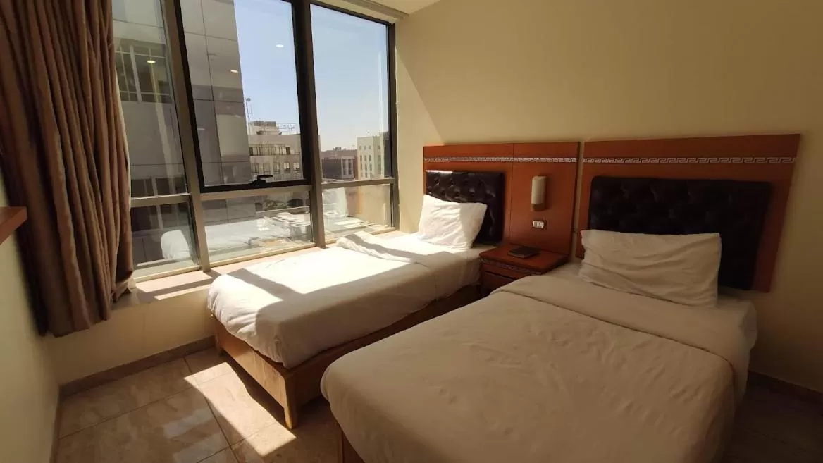 Bed in Jawharet Alswefiah Hotel Suites