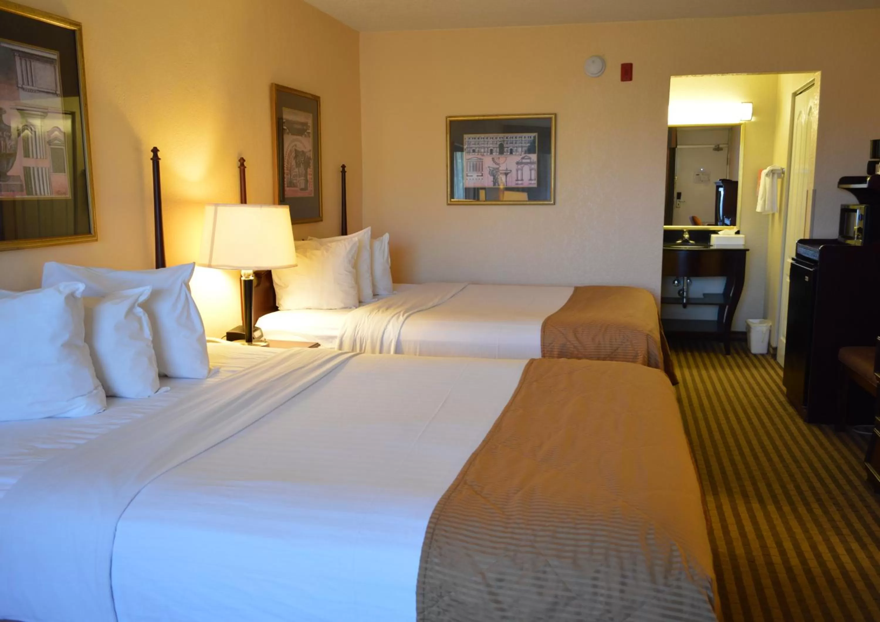 Bed in Opal Hotel & Suites