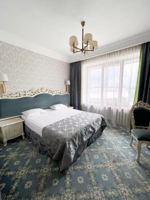 Bed in Royal Olympic Hotel