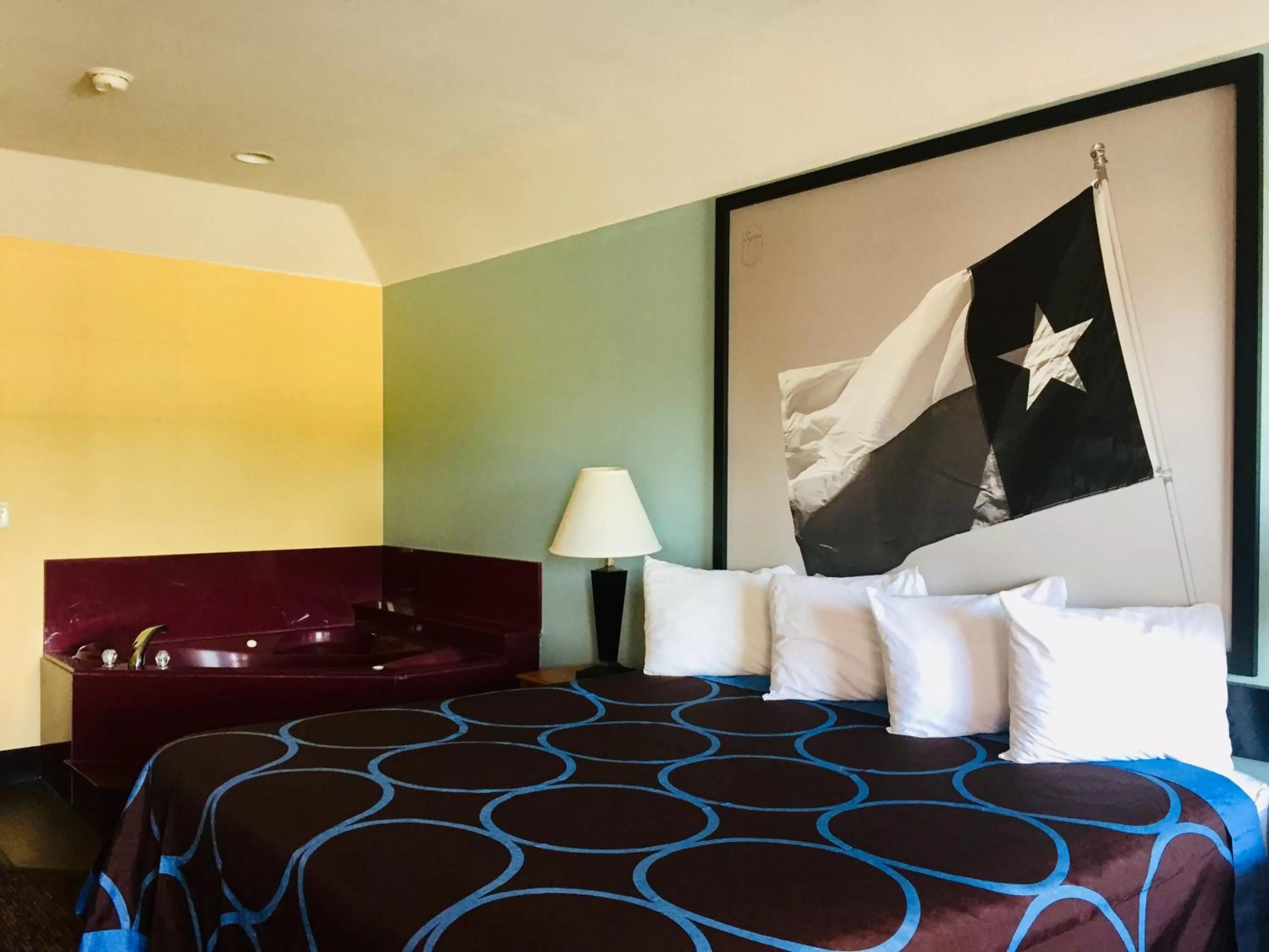 Bed in Super 8 by Wyndham Montgomery/ Lake Conroe