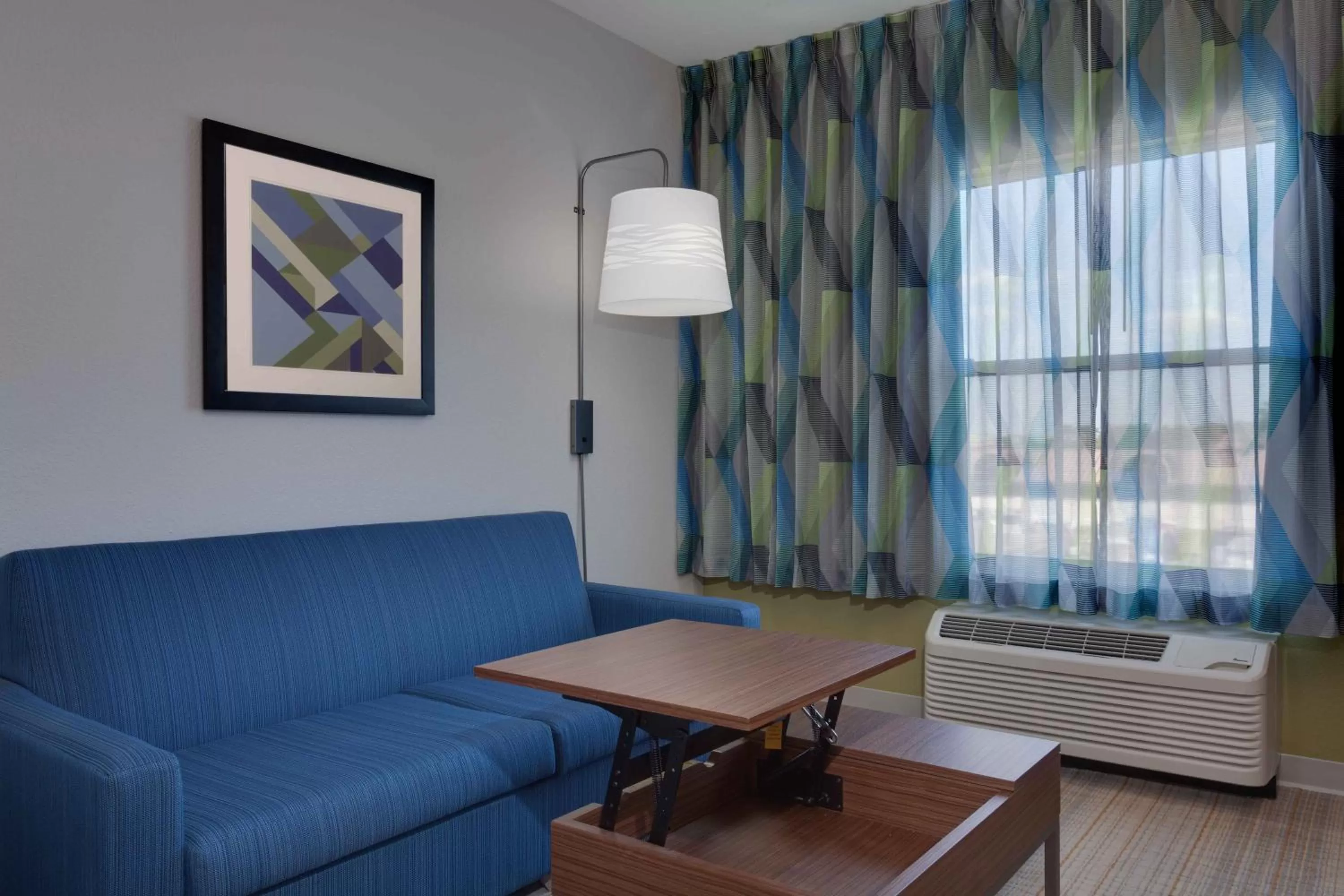Living room in Holiday Inn Express & Suites Orlando International Airport by IHG