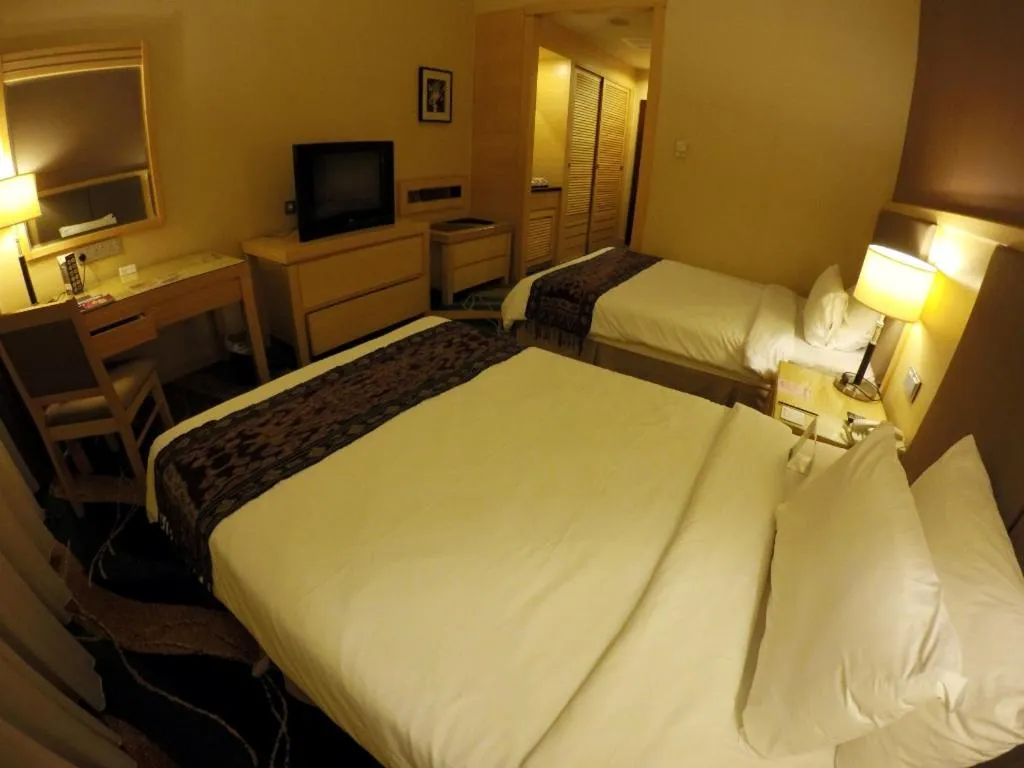 Bed in Imperial Palace Hotel