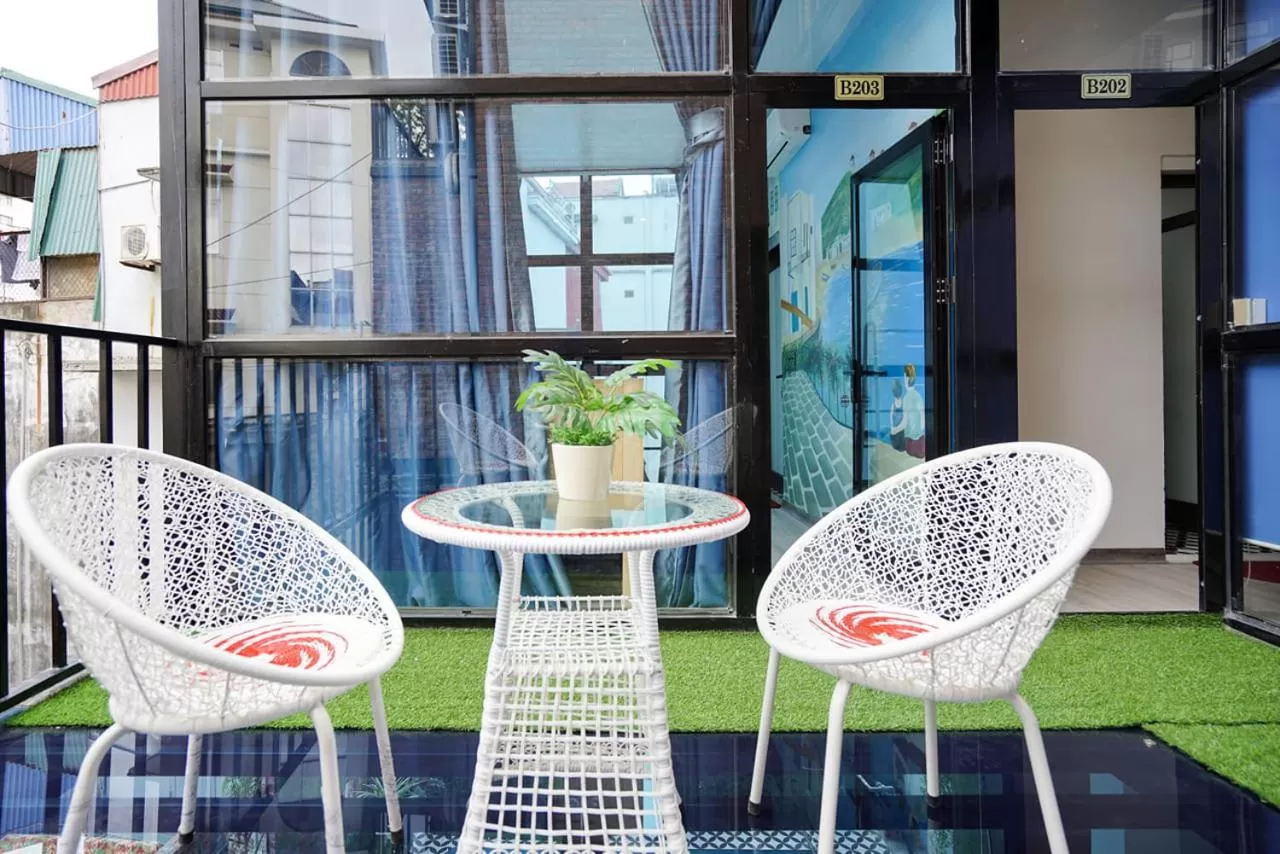 Patio in Almor Hostel With Pool in right center