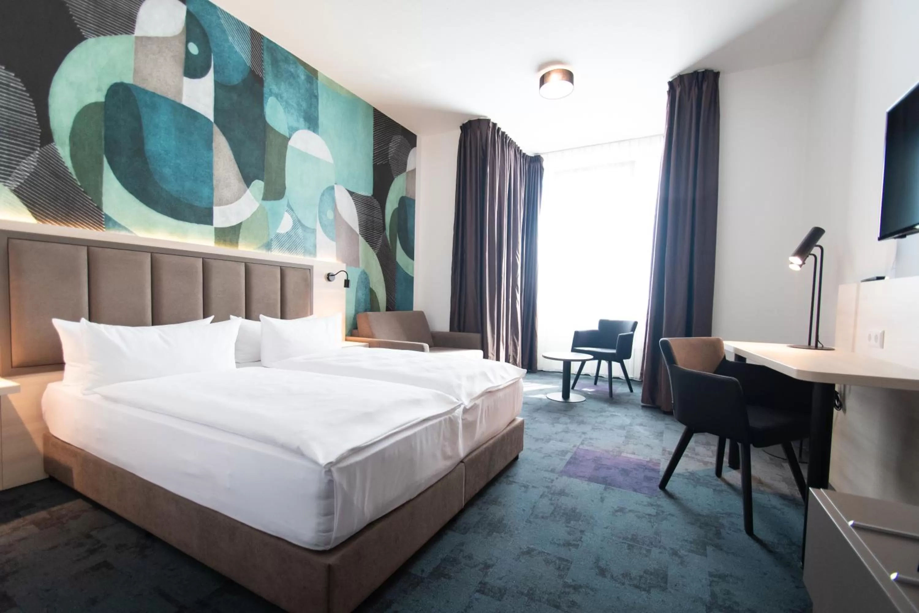 Photo of the whole room, Bed in Taste Hotel Kulmbach