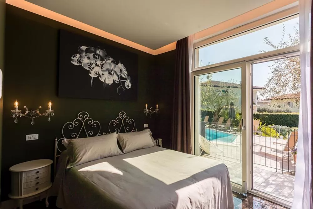 Bed in Art Hotel Ventaglio