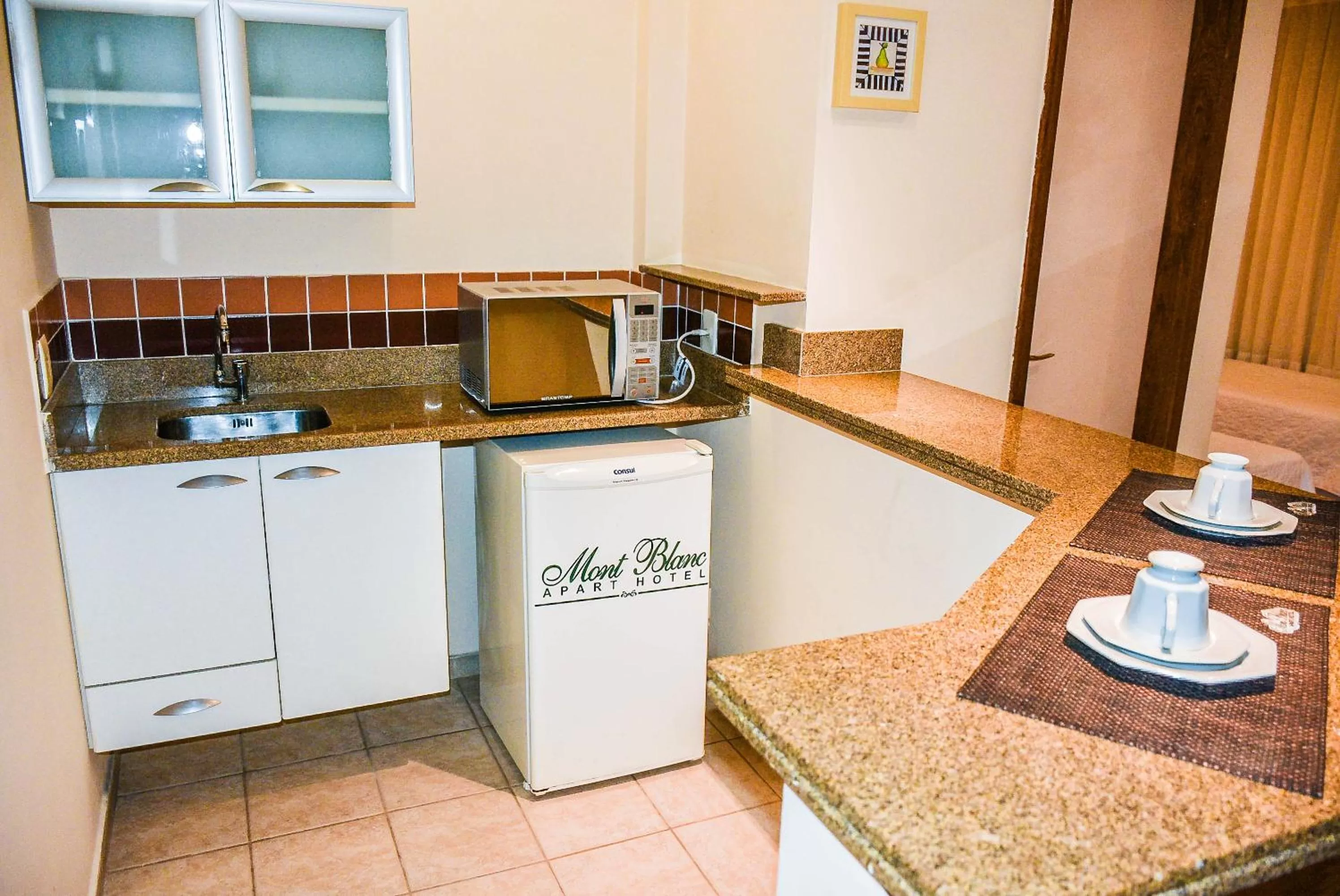 Kitchen or kitchenette in Mont Blanc Apart Hotel Nova Iguaçu