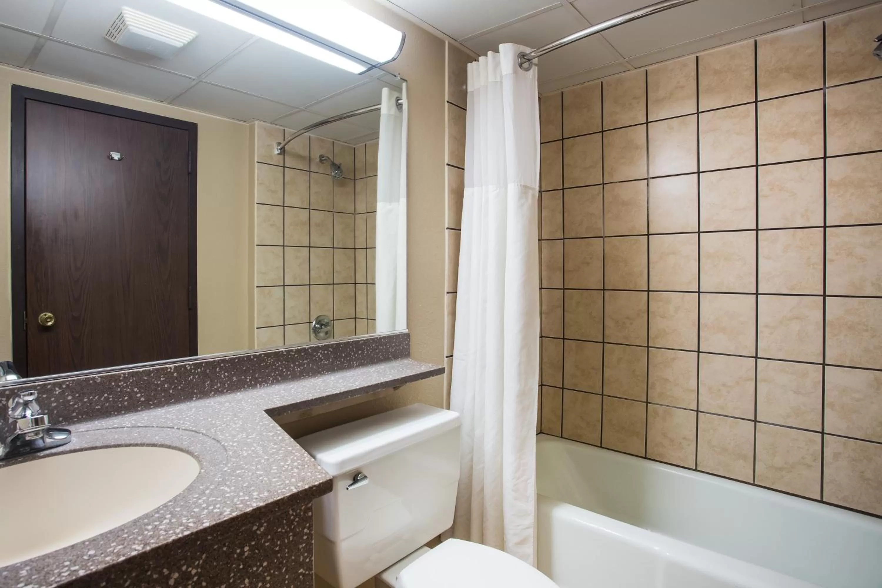 Toilet in AmericInn by Wyndham Janesville