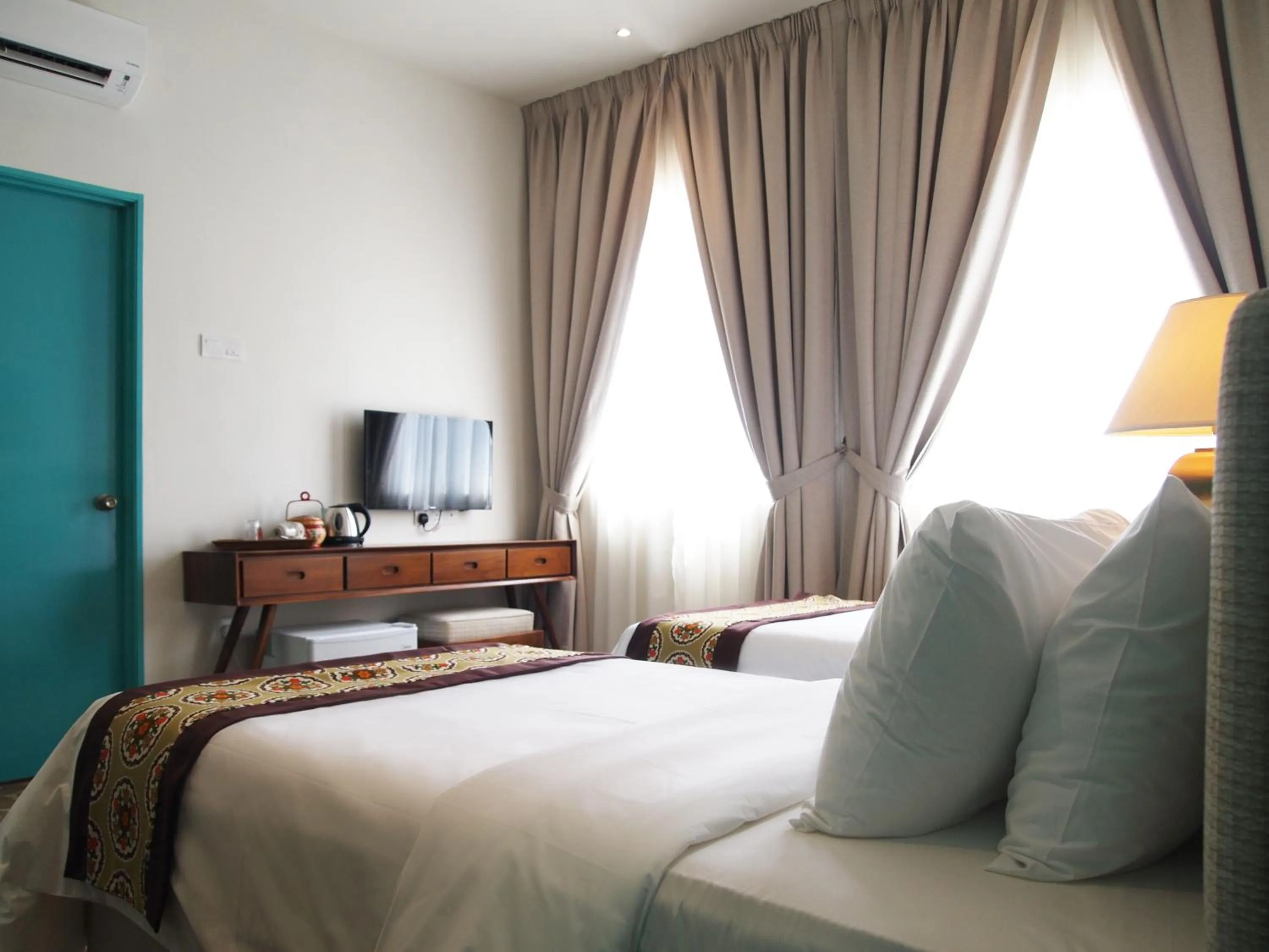 Bed in Kapitan Kongsi Boutique Hotel