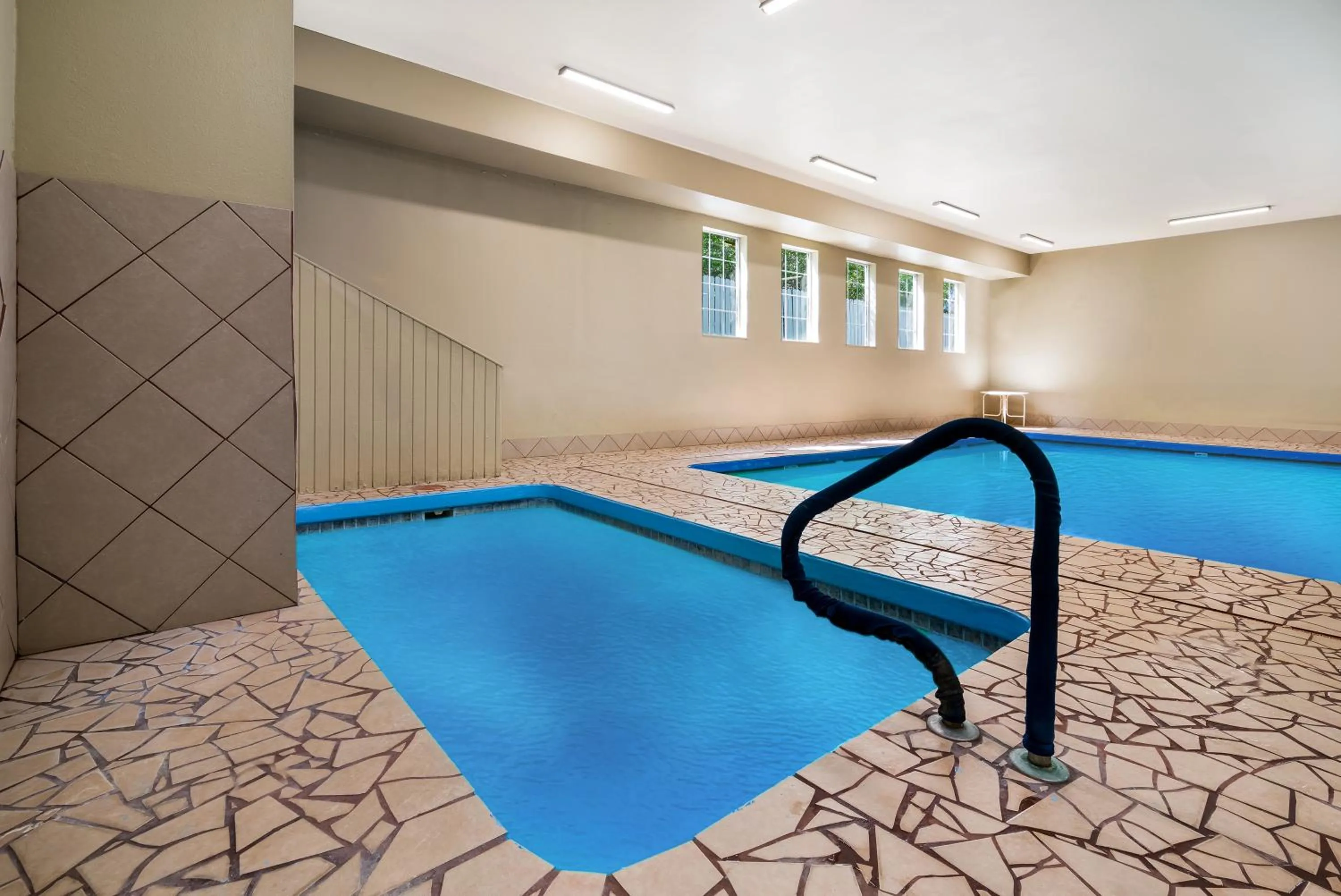 Swimming pool in SureStay Plus Hotel by Best Western Topeka