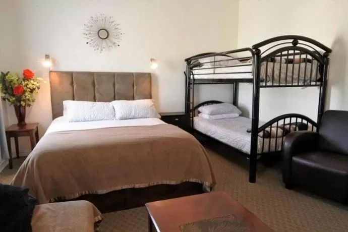 Bed in Black Rooster Guesthouse