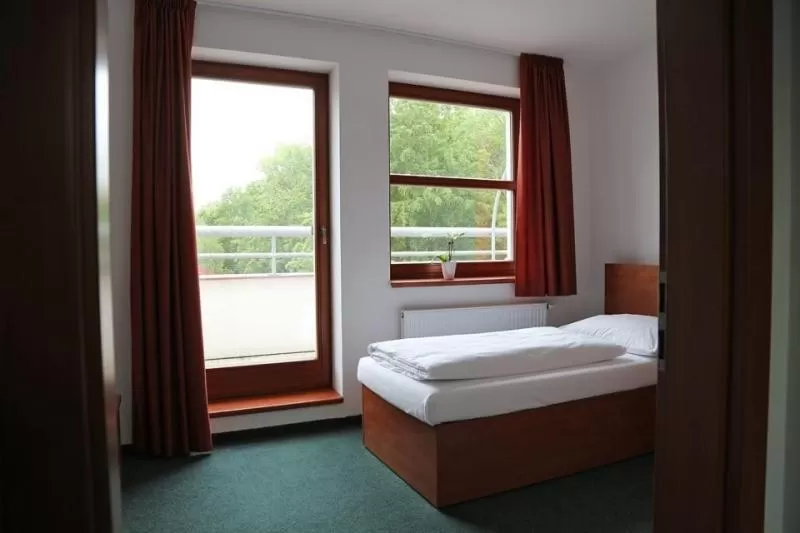 Bedroom, Bed in Sporthotel Hostivice