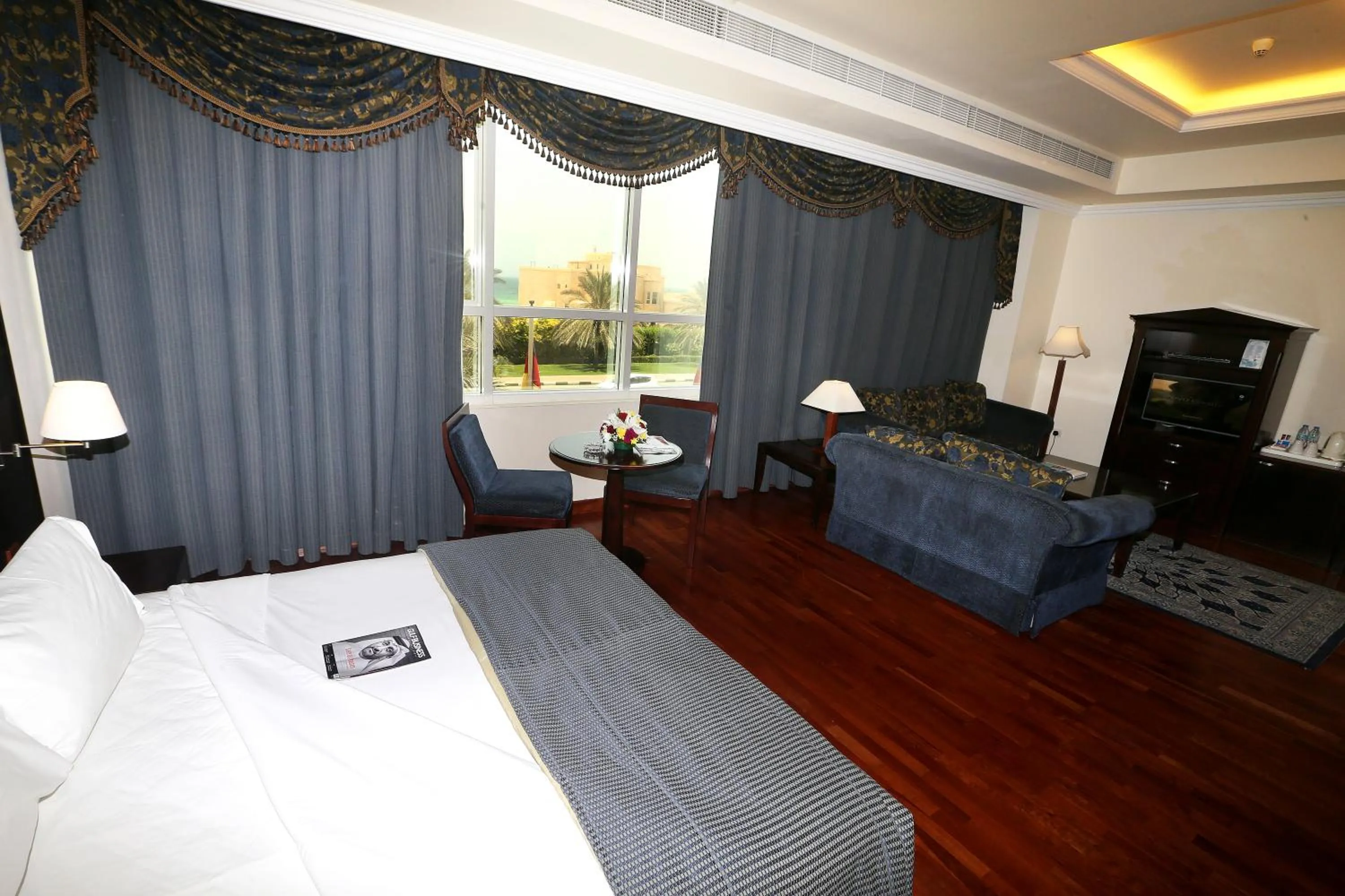 Seating area, Bed in Sharjah Premiere Hotel & Resort