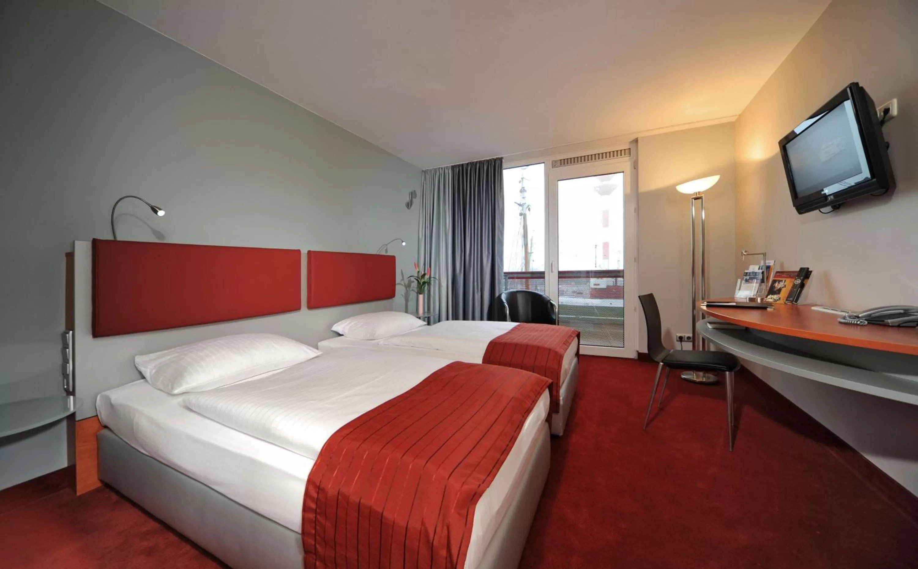 Photo of the whole room, Bed in Nordsee Hotel Fischereihafen