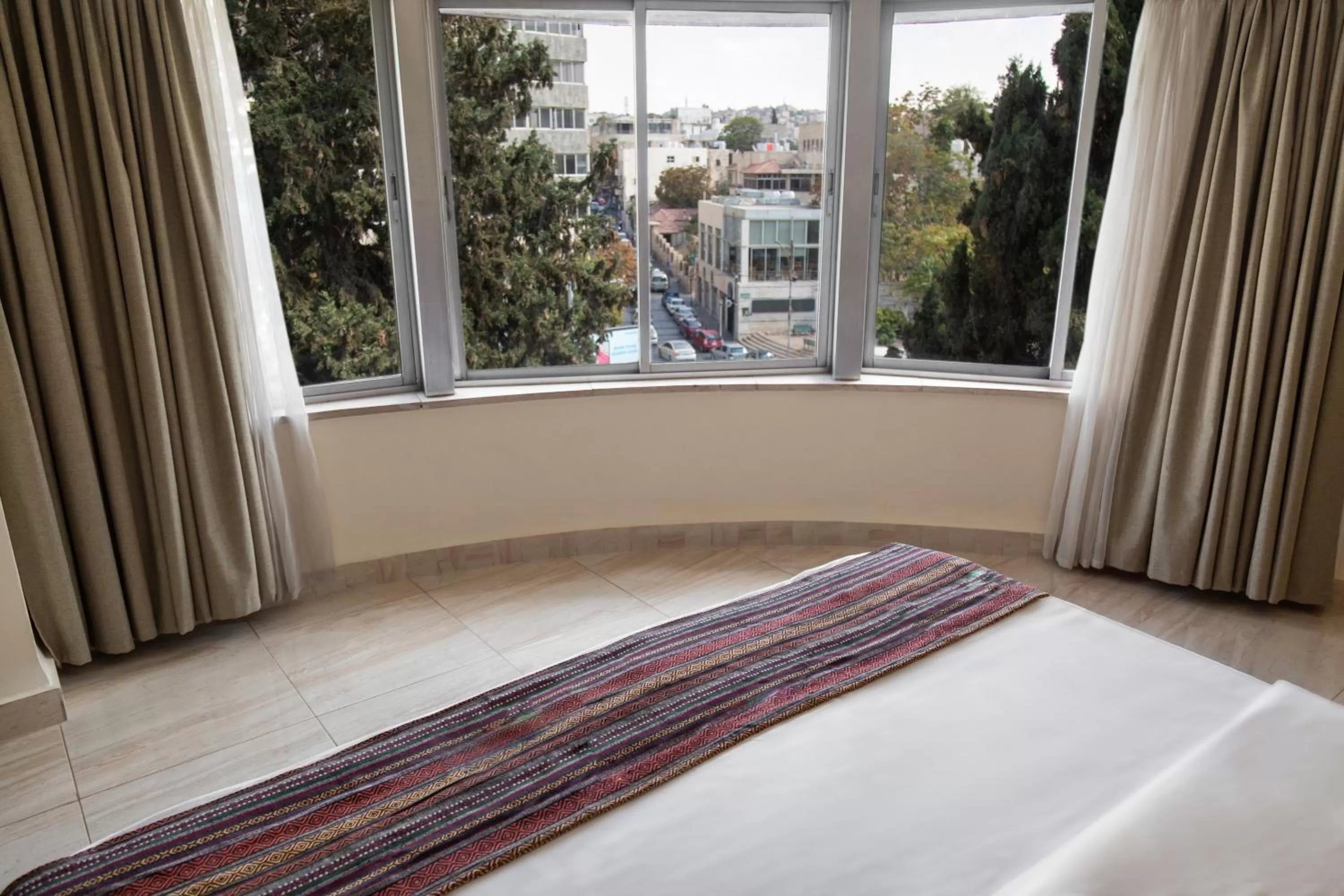 Landmark view, Bed in Antika Amman Hotel