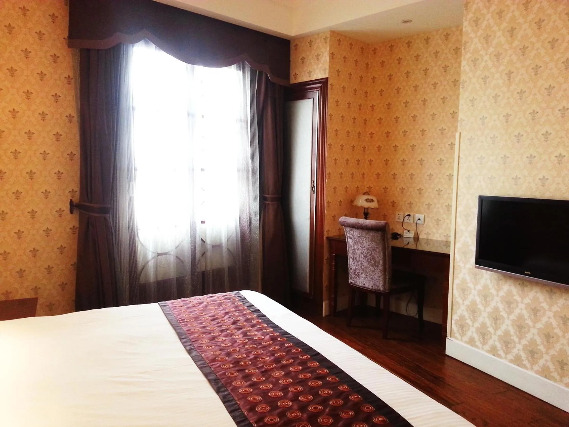 Bed in Seventh Heaven Hotel