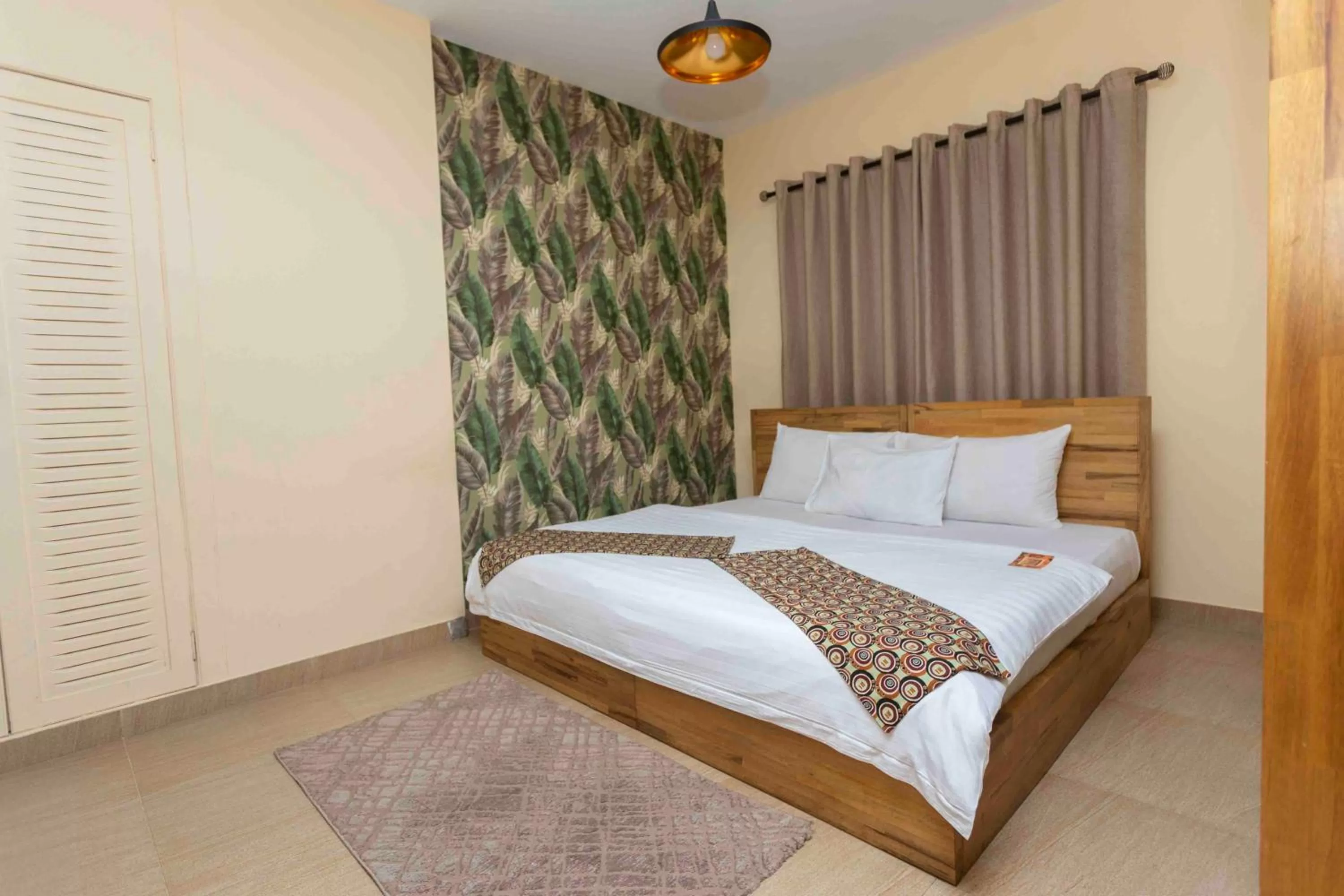 Bed in Roots Hotel Apartment