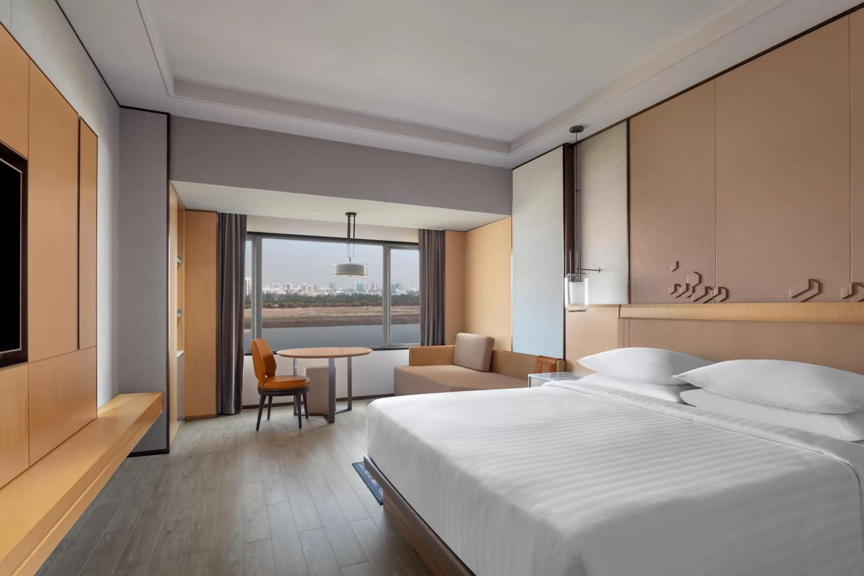 Deluxe Room, Guest room, 1 King, River view - 20% discount on Food & Beverage valid till June 2025 in Surat Marriott Hotel