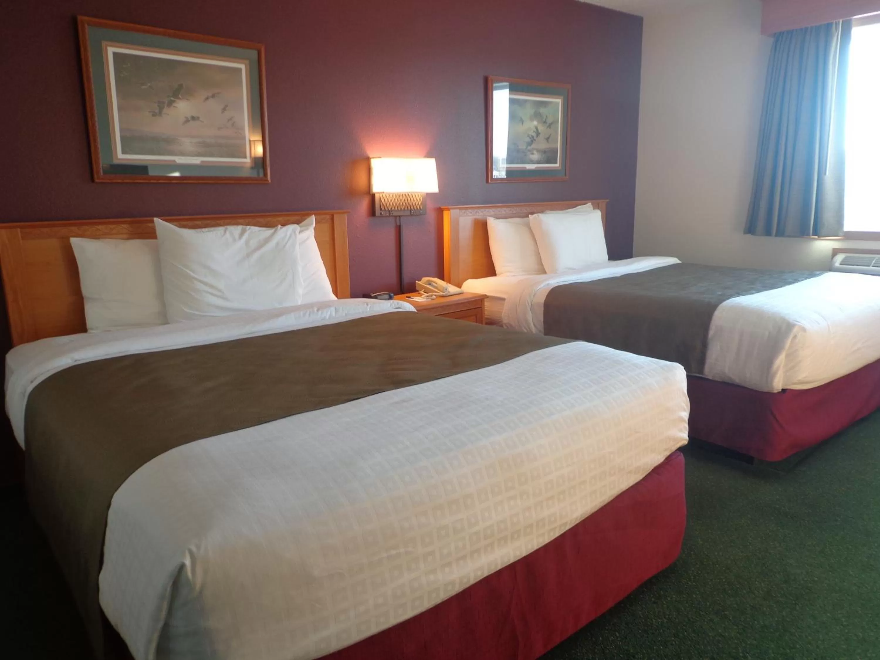 Bed in AmericInn by Wyndham Madison SD