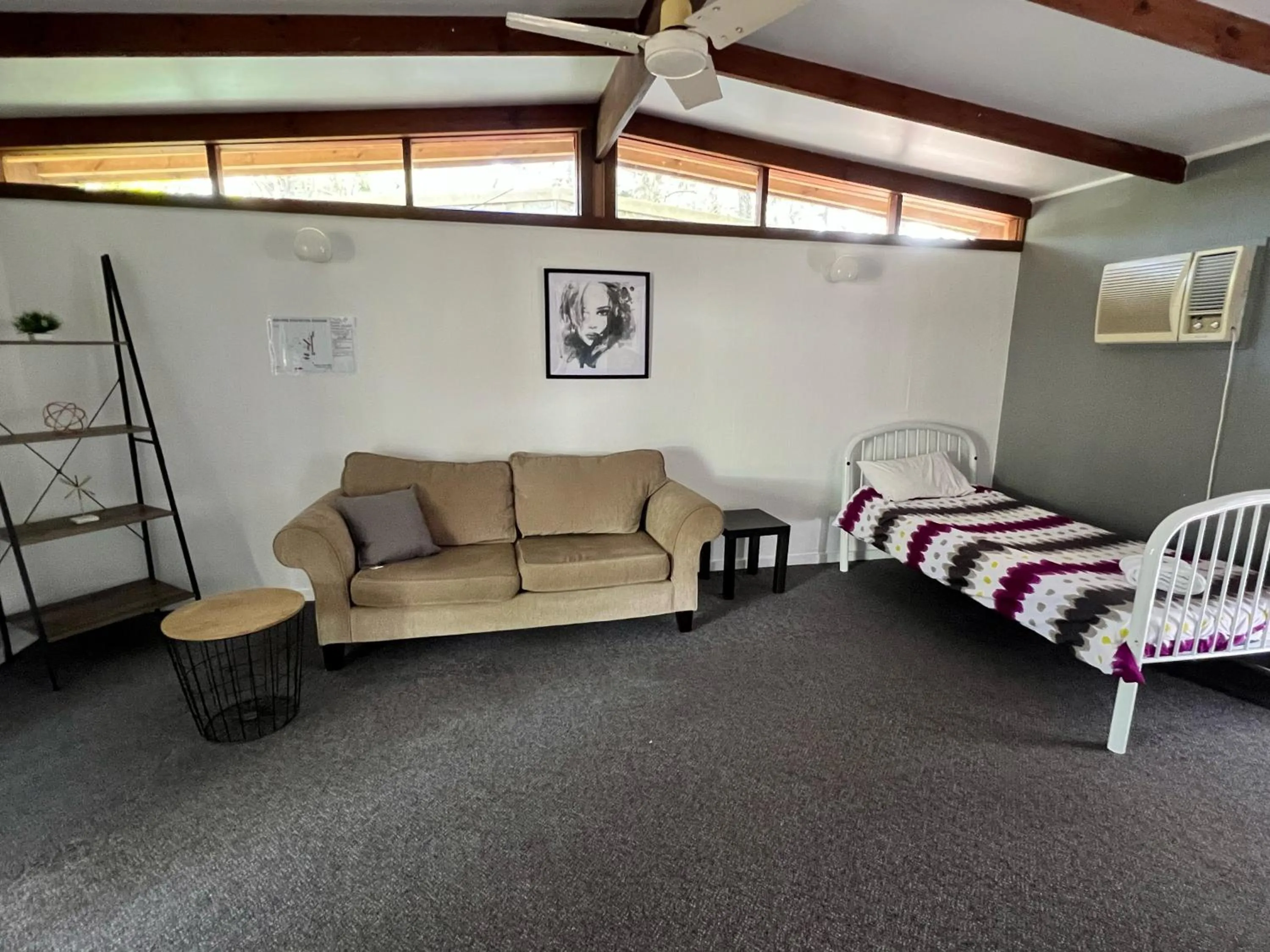 Bed in Colonial Village Resort