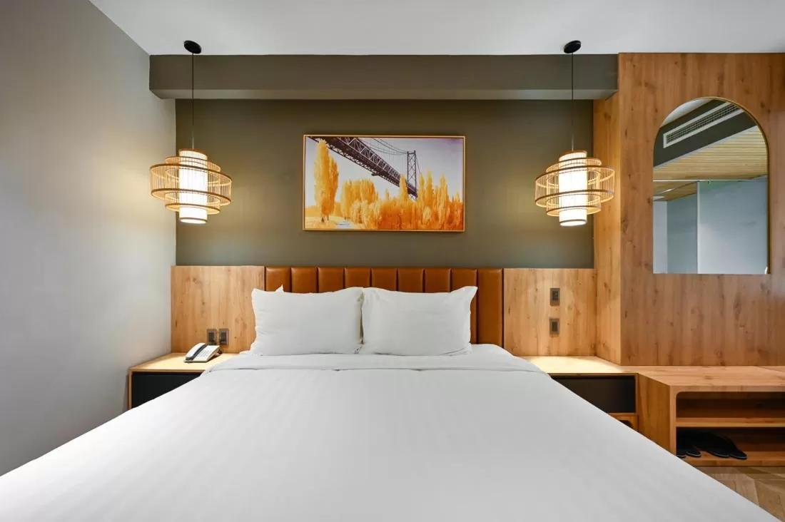 Bedroom in La Opera Saigon Hotel