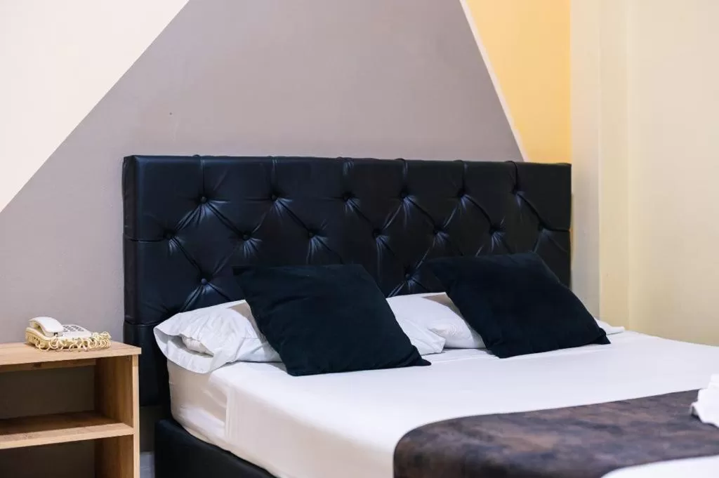 Bed in HOTEL CALLE REAL SUITE