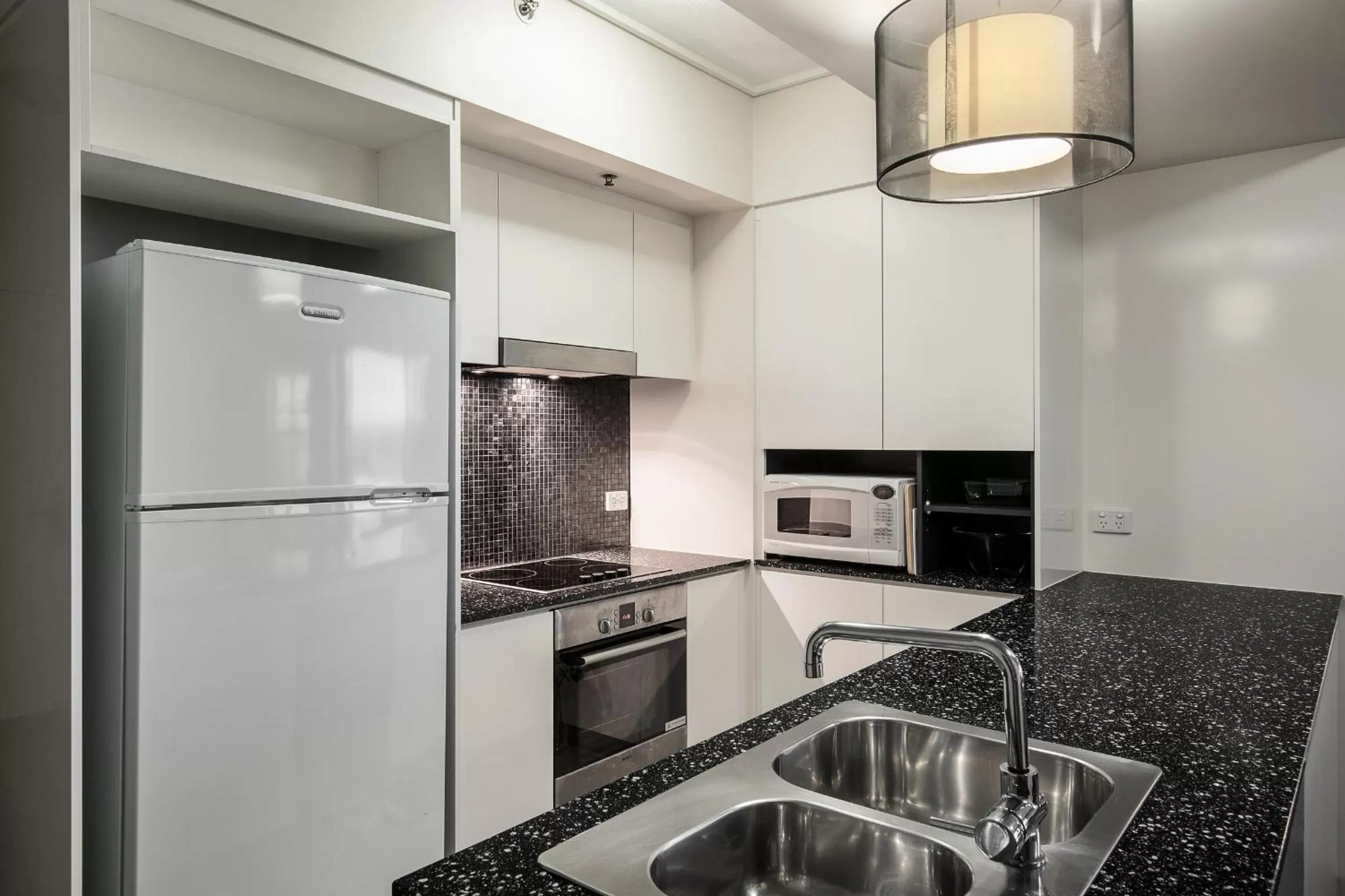 Kitchen or kitchenette in Evolution Apartments