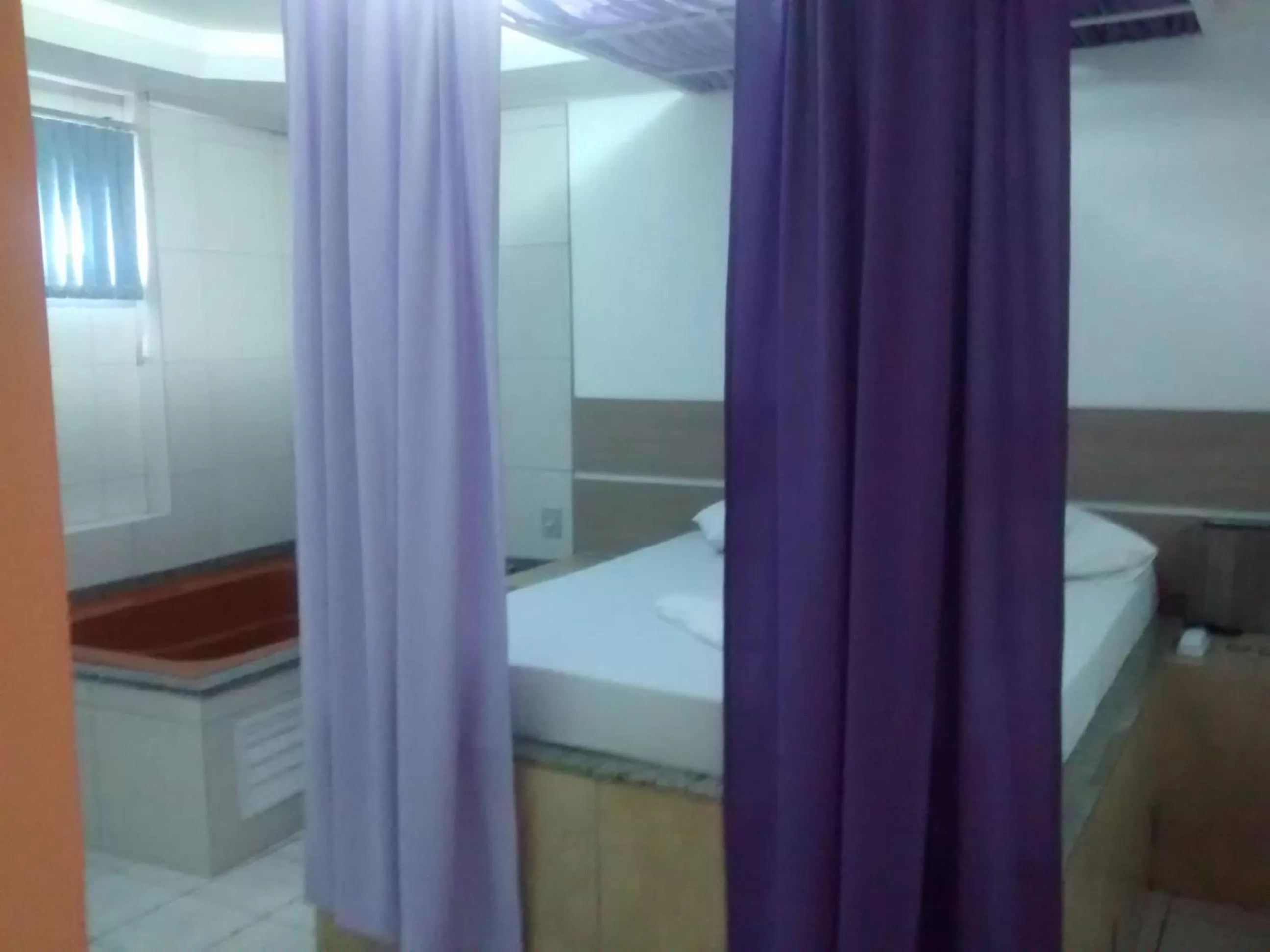 Bedroom in Classic Hotel e Motel